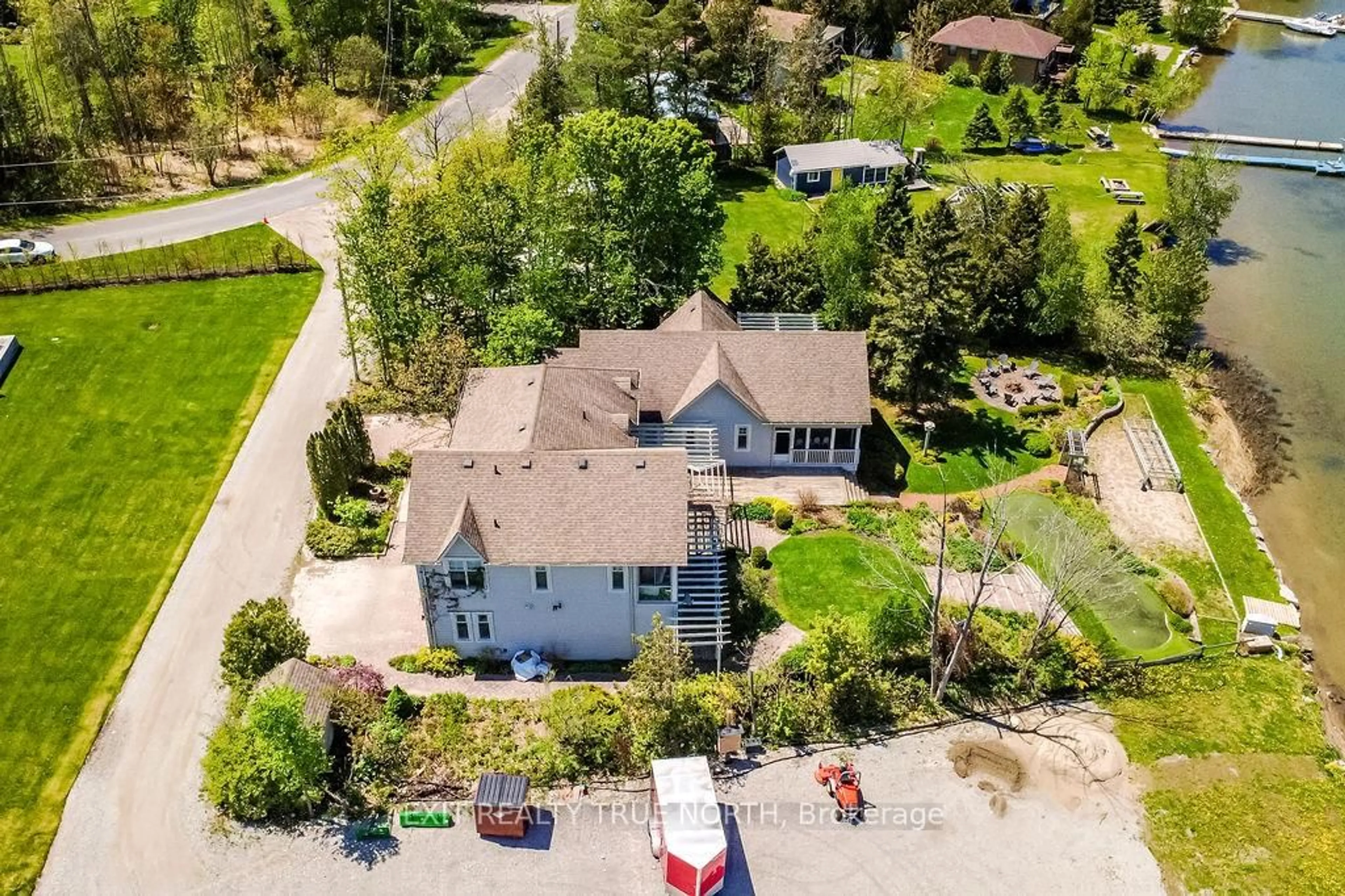 A pic from outside/outdoor area/front of a property/back of a property/a pic from drone, street for 3021 Sandy Bend, Springwater Ontario L0L 1P0