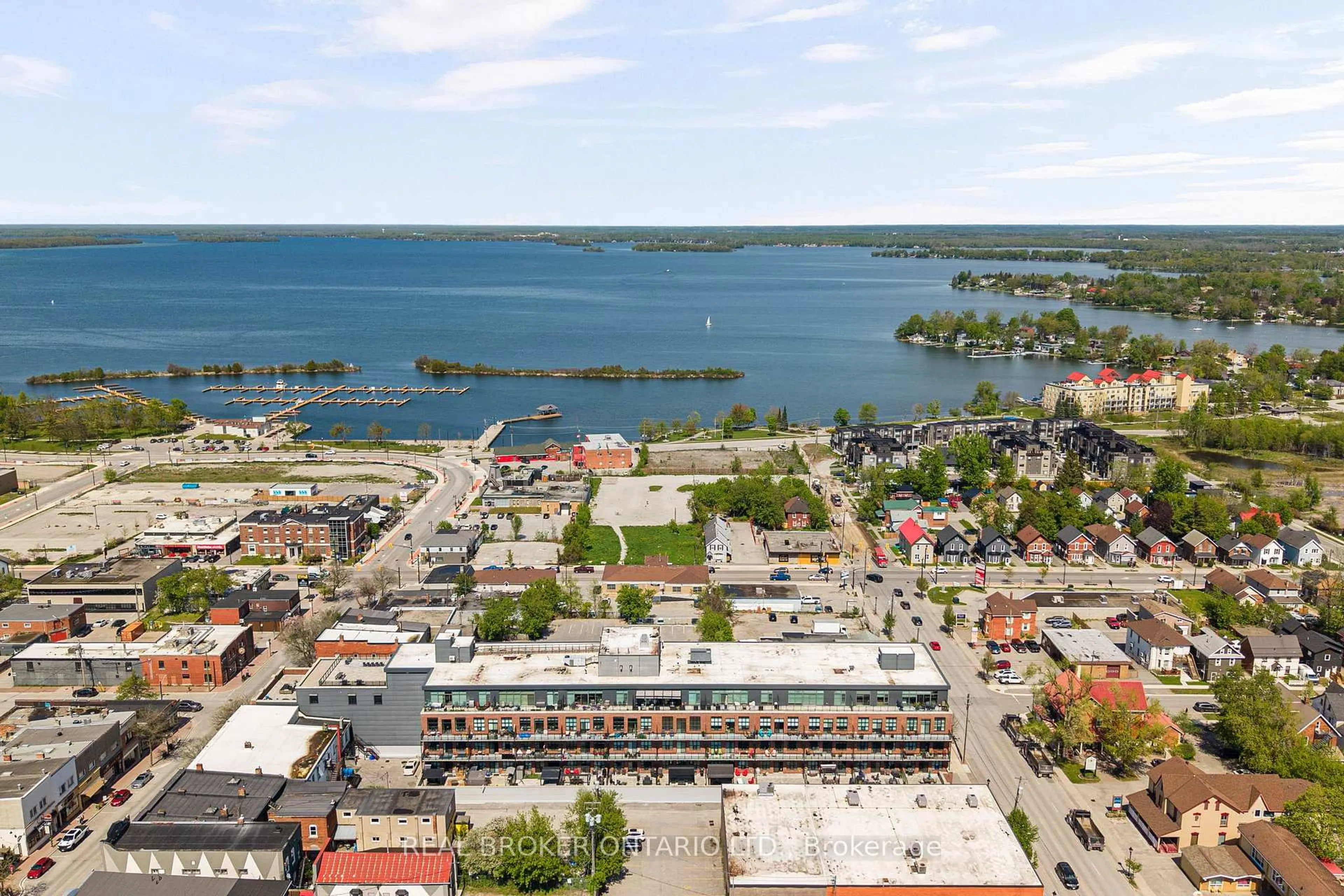 A pic from outside/outdoor area/front of a property/back of a property/a pic from drone, water/lake/river/ocean view for 21 Matchedash St #204, Orillia Ontario L3V 4W4