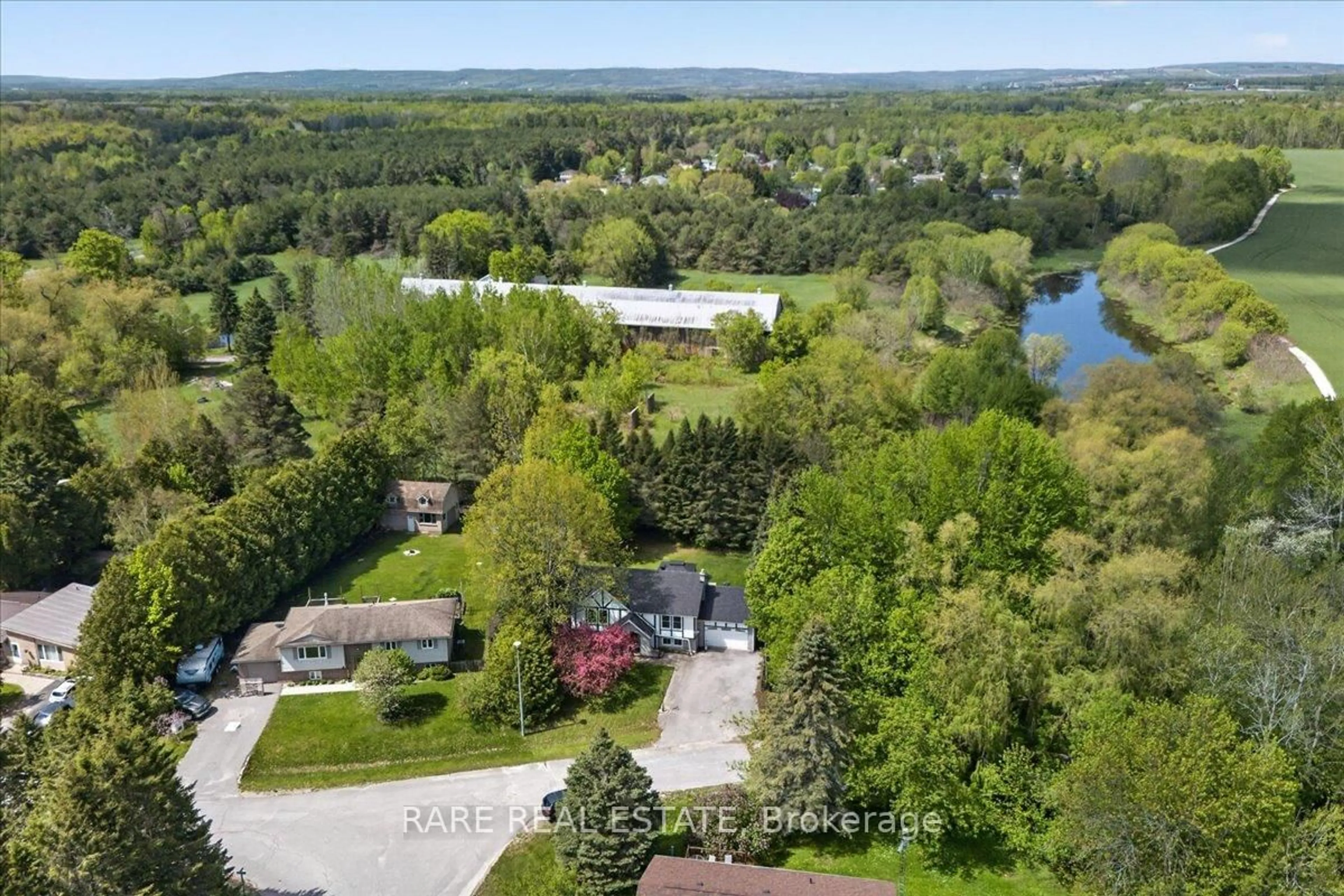 A pic from outside/outdoor area/front of a property/back of a property/a pic from drone, water/lake/river/ocean view for 14 Oakdale Dr, Clearview Ontario L0M 1N0