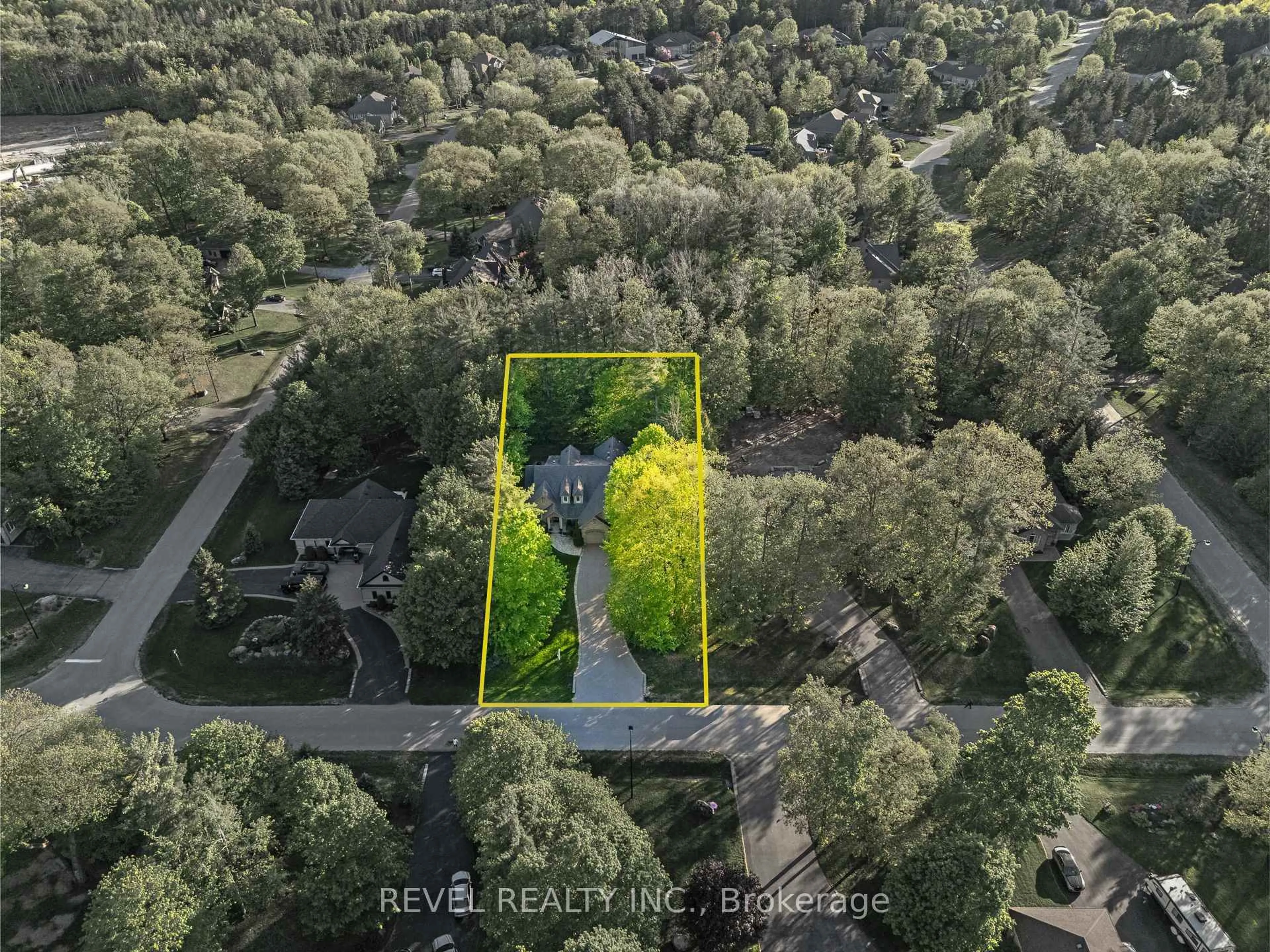 A pic from outside/outdoor area/front of a property/back of a property/a pic from drone, forest/trees view for 23 Laddie Lane, Springwater Ontario L9X 0C3