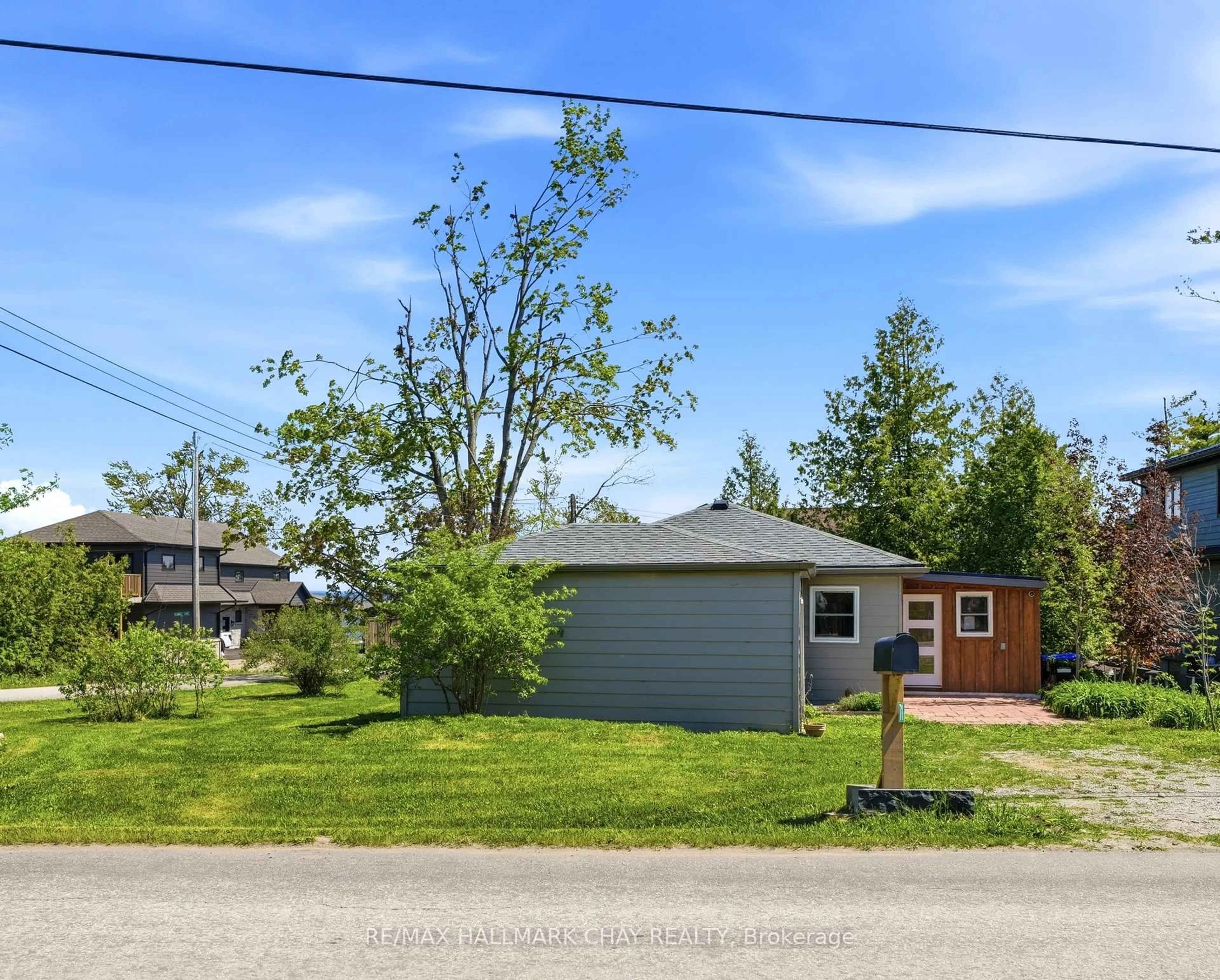 A pic from outside/outdoor area/front of a property/back of a property/a pic from drone, street for 71 Lakeshore Rd, Oro-Medonte Ontario L0L 2E0