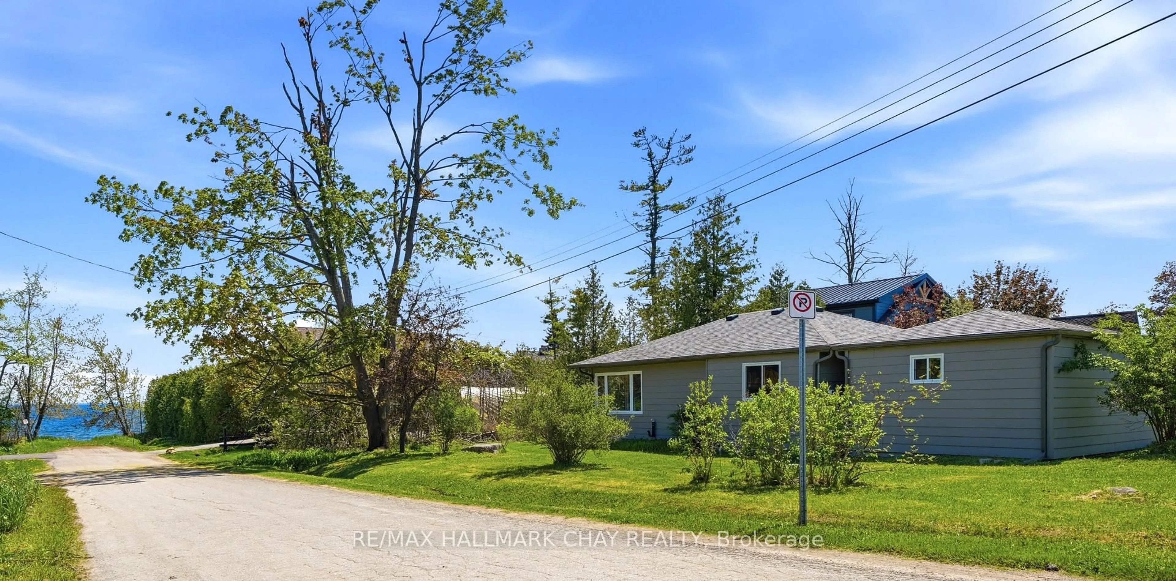 A pic from outside/outdoor area/front of a property/back of a property/a pic from drone, street for 71 Lakeshore Rd, Oro-Medonte Ontario L0L 2E0