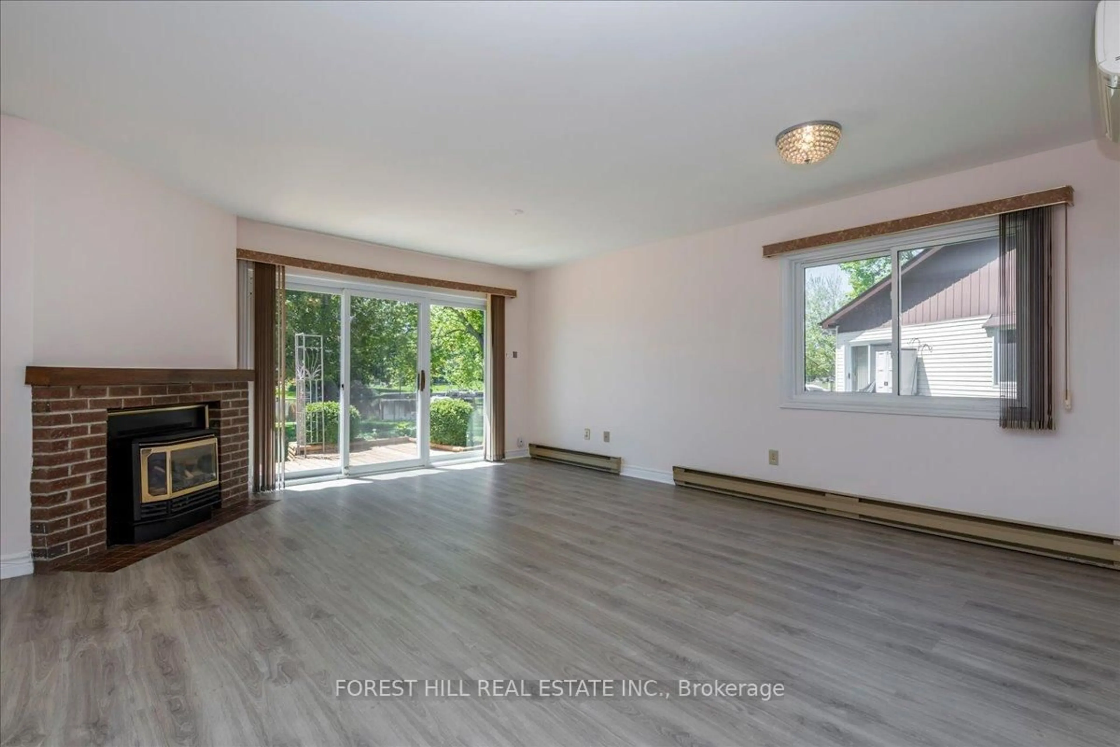 Living room with furniture, wood/laminate floor for 70 Laguna Pkwy #9, Ramara Ontario L0K 1B0