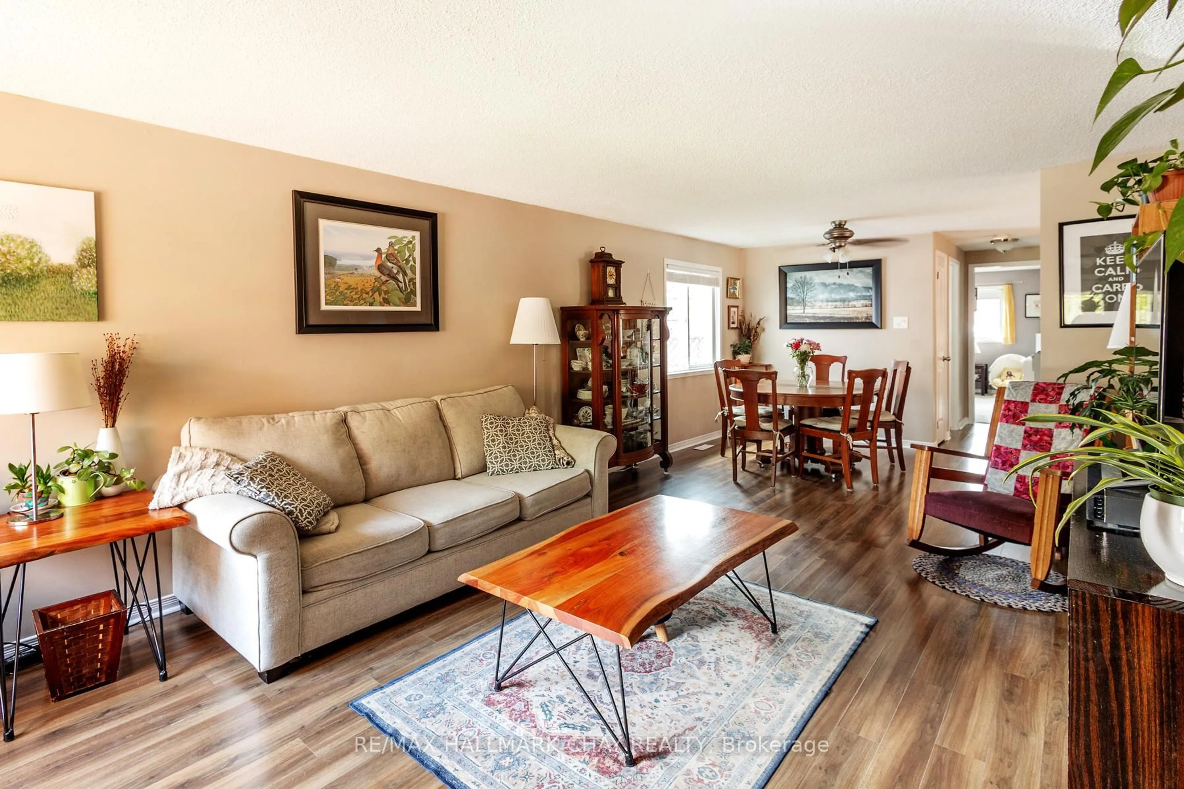 Living room with furniture, wood/laminate floor for 90 Laidlaw Dr, Barrie Ontario L4N 7S2