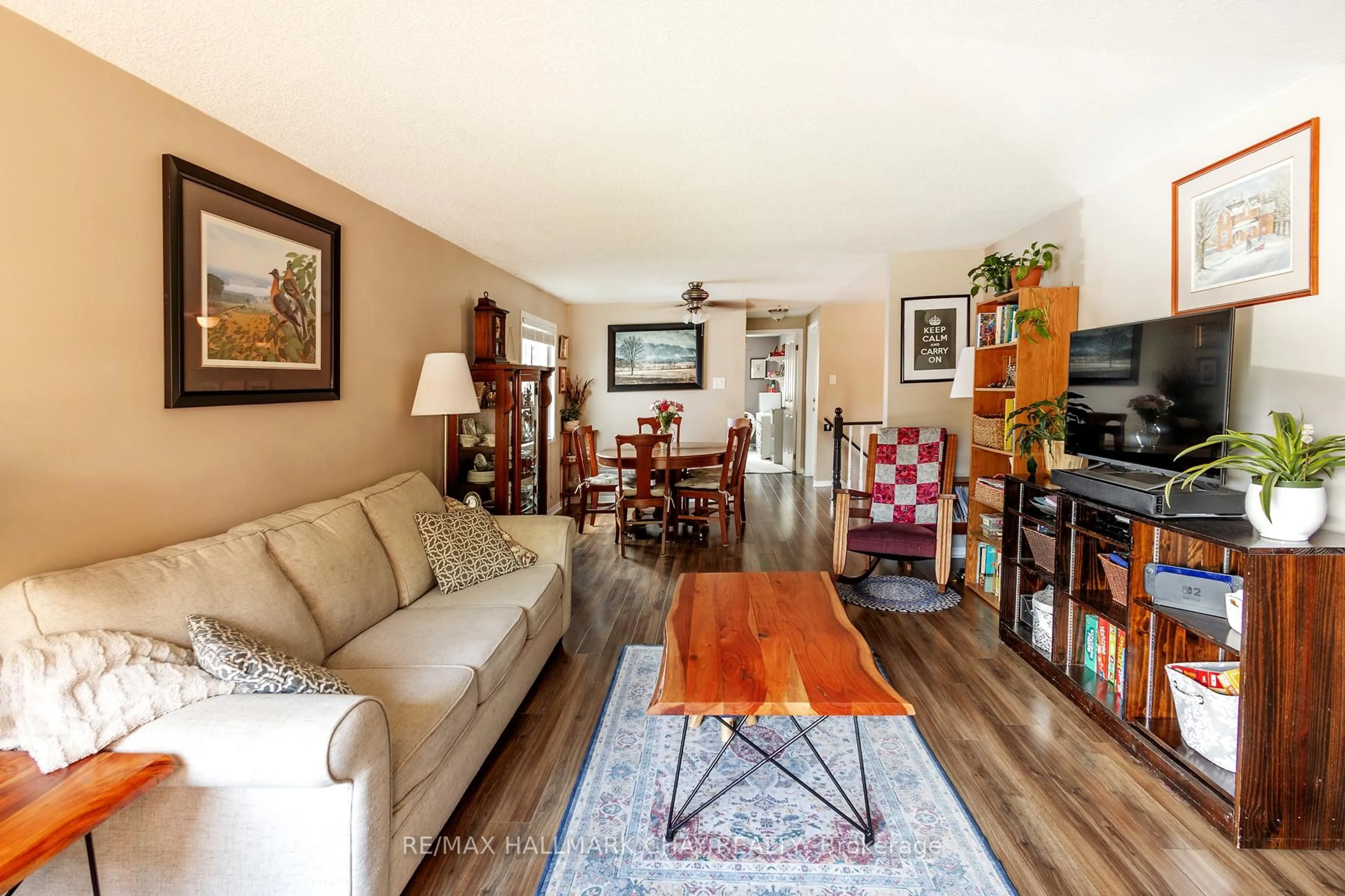 Living room with furniture, wood/laminate floor for 90 Laidlaw Dr, Barrie Ontario L4N 7S2