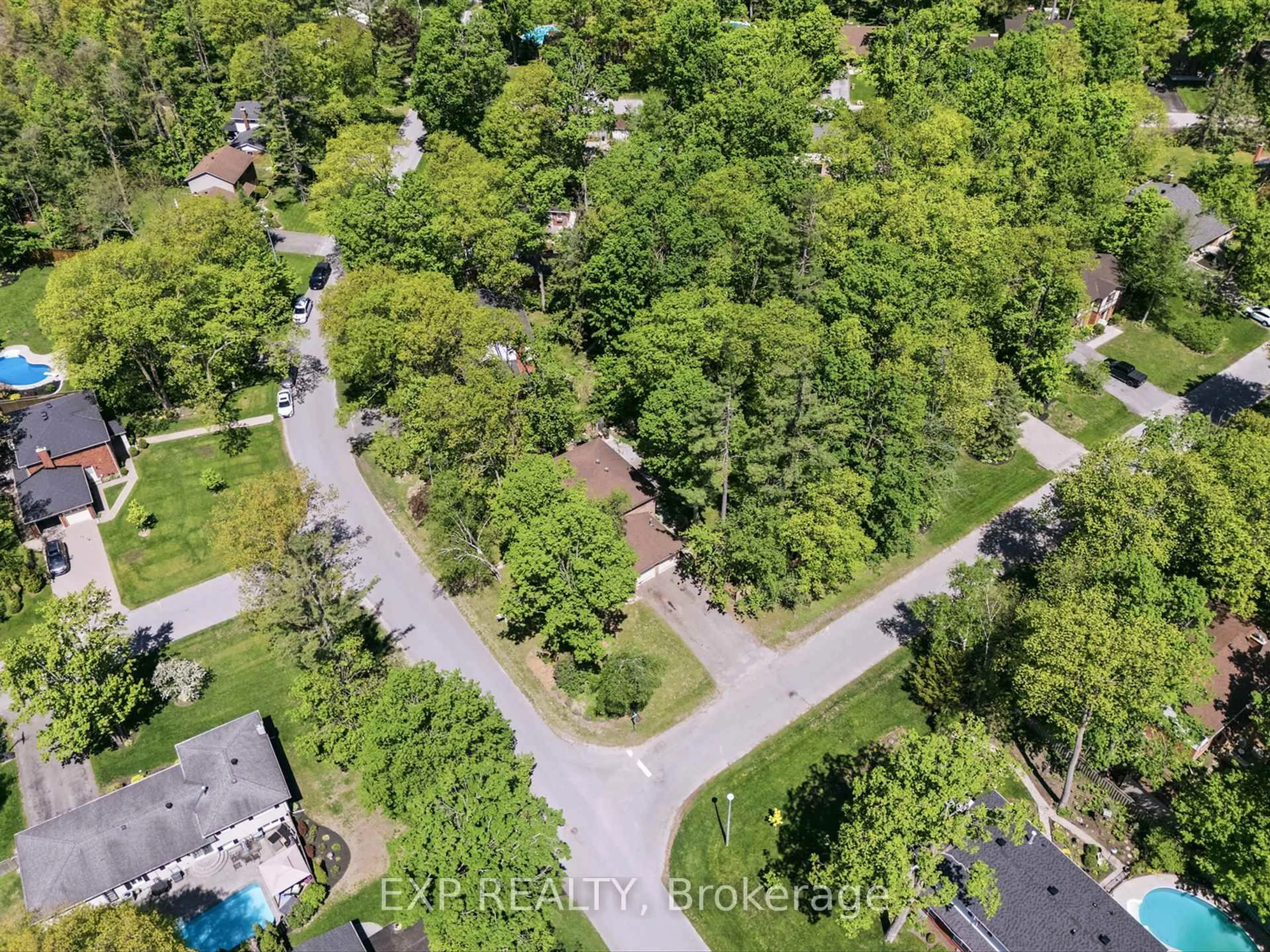 A pic from outside/outdoor area/front of a property/back of a property/a pic from drone, forest/trees view for 11 Spence Ave, Springwater Ontario L9X 0P2