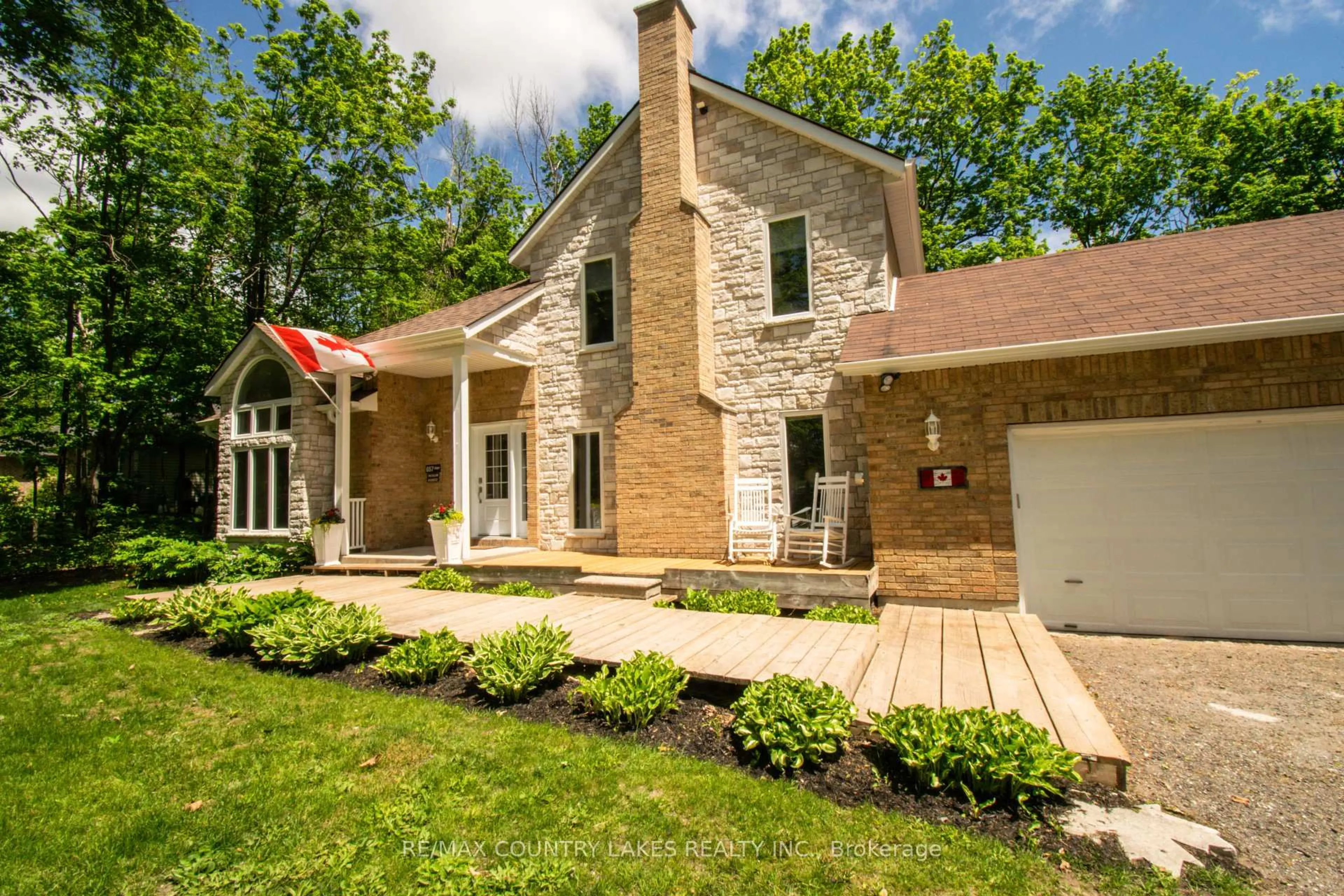 Home with brick exterior material, street for 657 13th Line, Oro-Medonte Ontario L0L 1T0