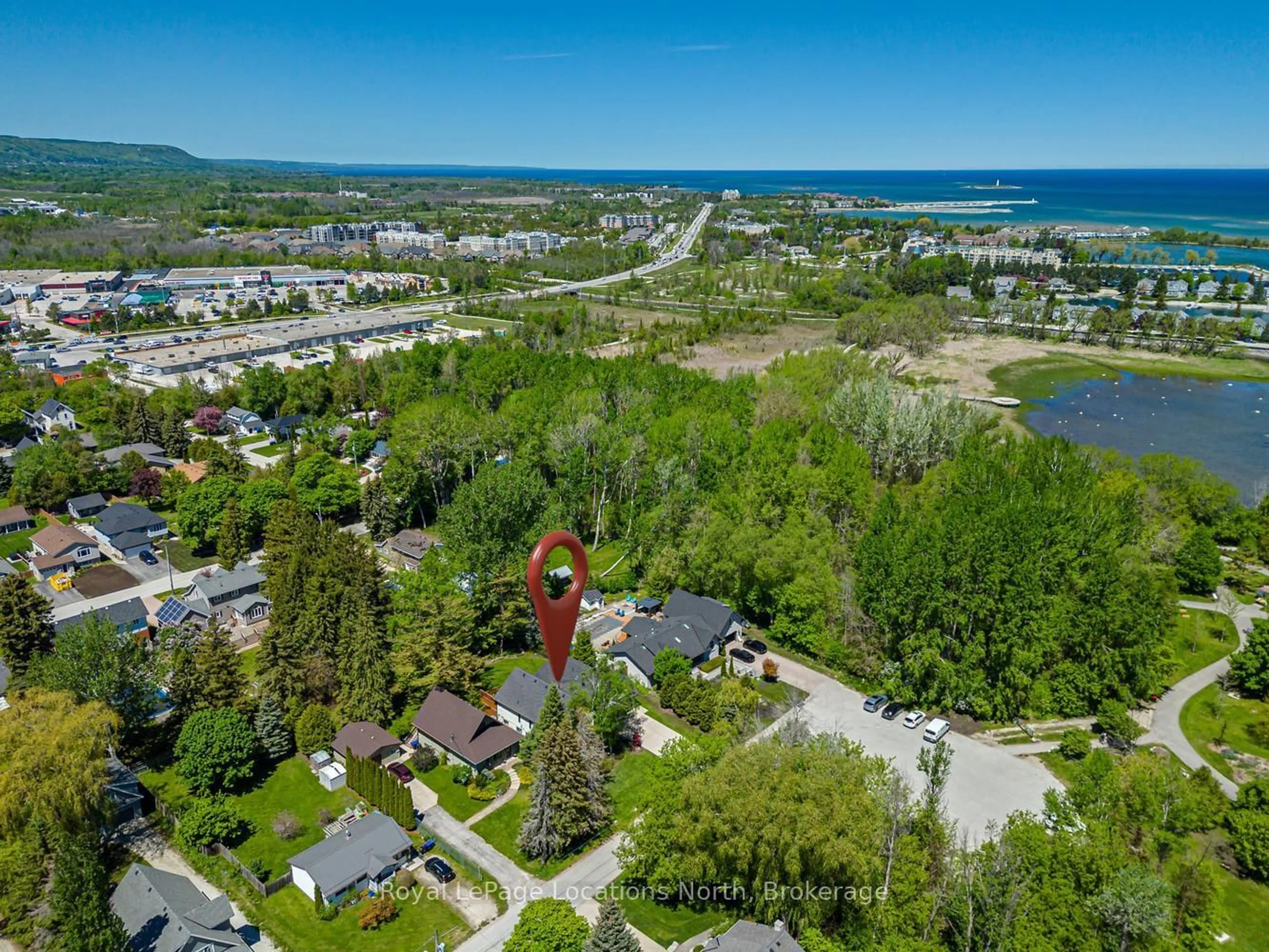 A pic from outside/outdoor area/front of a property/back of a property/a pic from drone, water/lake/river/ocean view for 8 HICKORY St, Collingwood Ontario L9Y 3E4