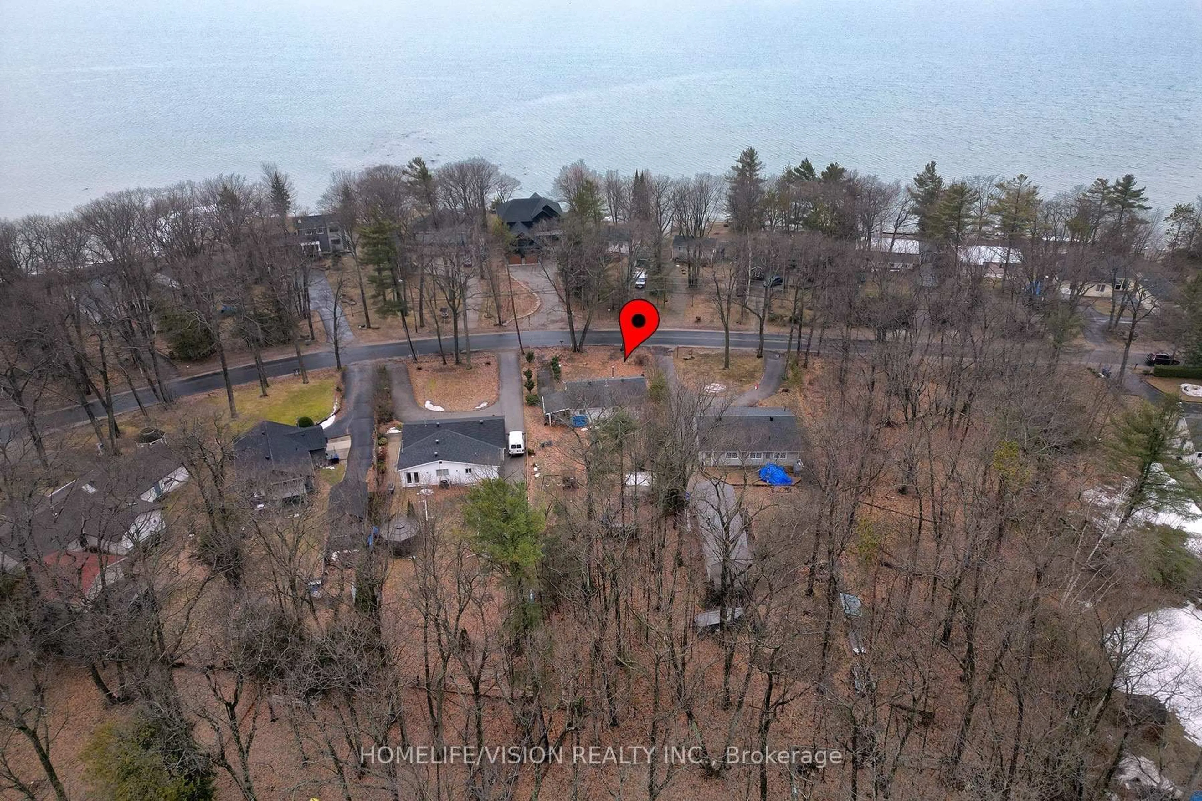 A pic from outside/outdoor area/front of a property/back of a property/a pic from drone, forest/trees view for 1807 Tiny Beaches Rd, Tiny Ontario L0L 1P1