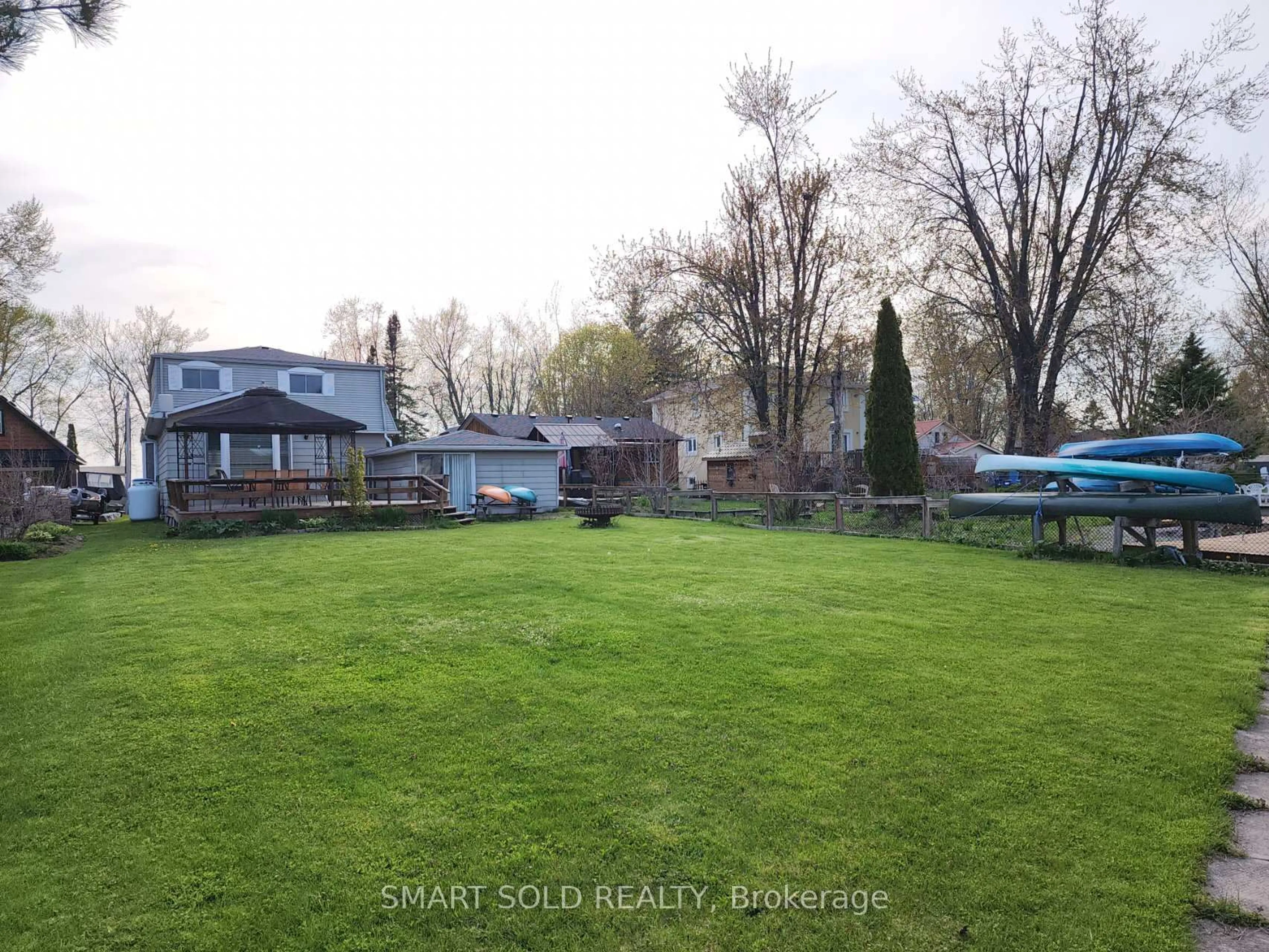 A pic from outside/outdoor area/front of a property/back of a property/a pic from drone, water/lake/river/ocean view for 75 Lake Ave, Ramara Ontario L0K 1B0