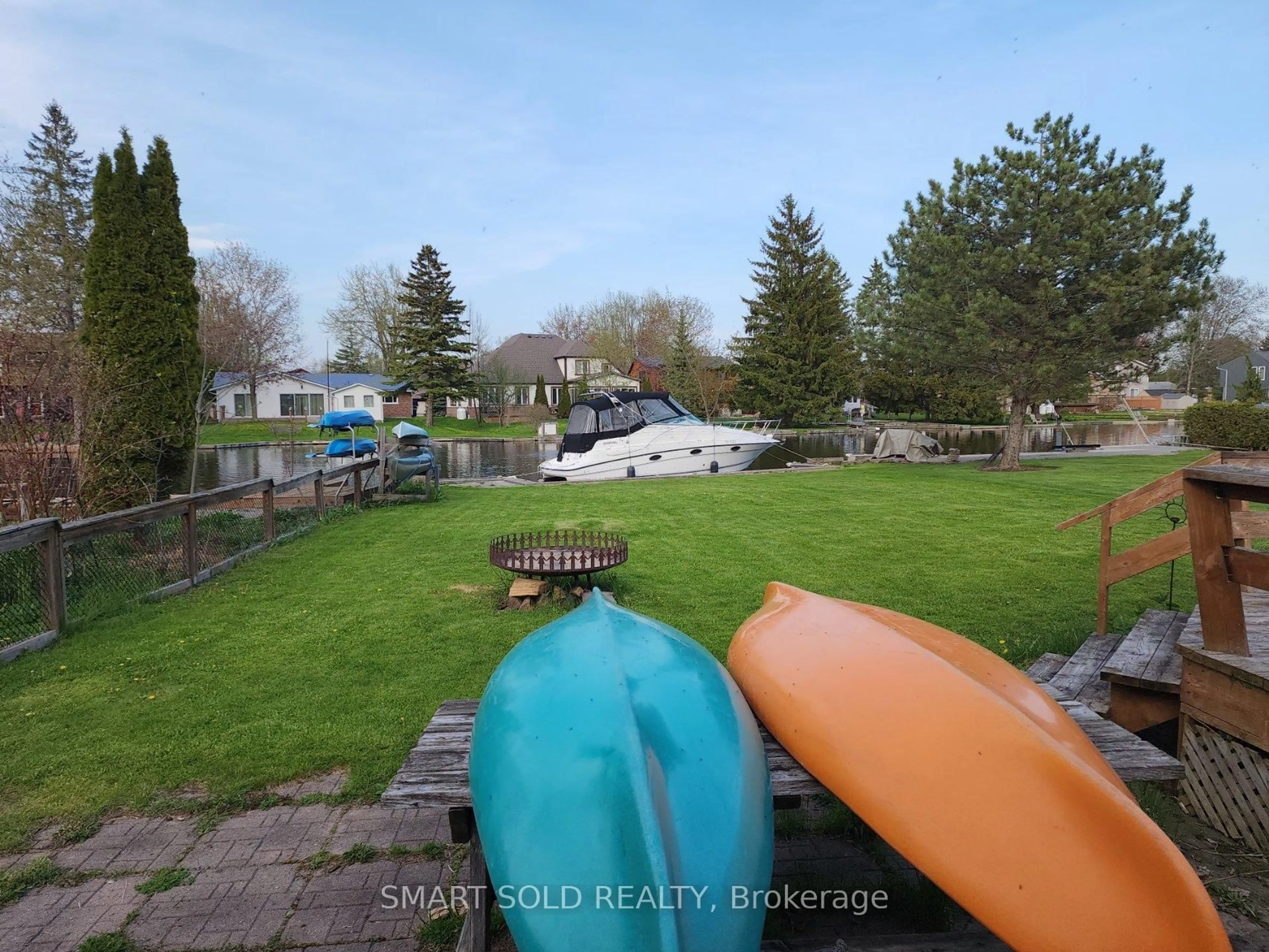 A pic from outside/outdoor area/front of a property/back of a property/a pic from drone, water/lake/river/ocean view for 75 Lake Ave, Ramara Ontario L0K 1B0