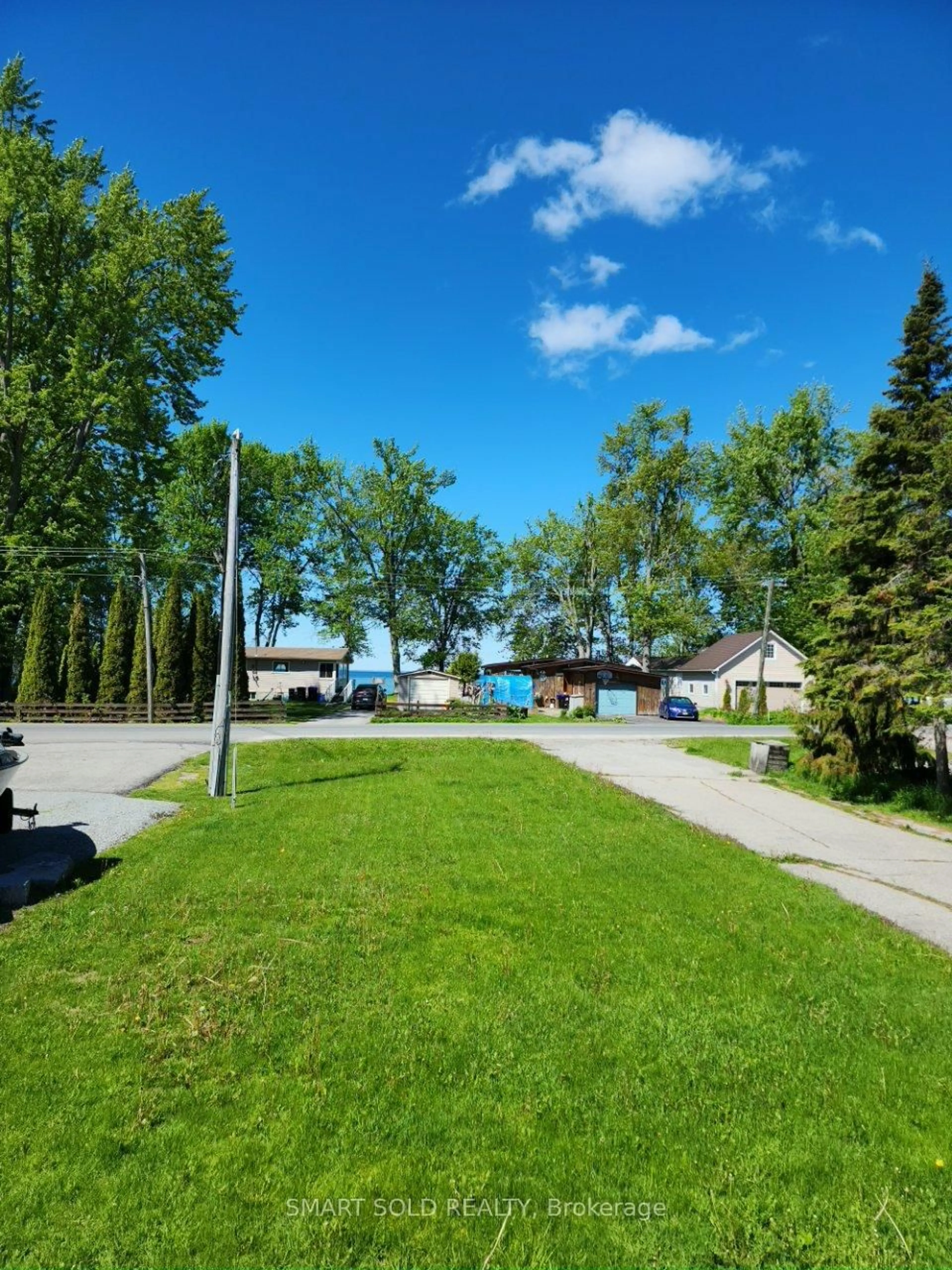 A pic from outside/outdoor area/front of a property/back of a property/a pic from drone, street for 75 Lake Ave, Ramara Ontario L0K 1B0