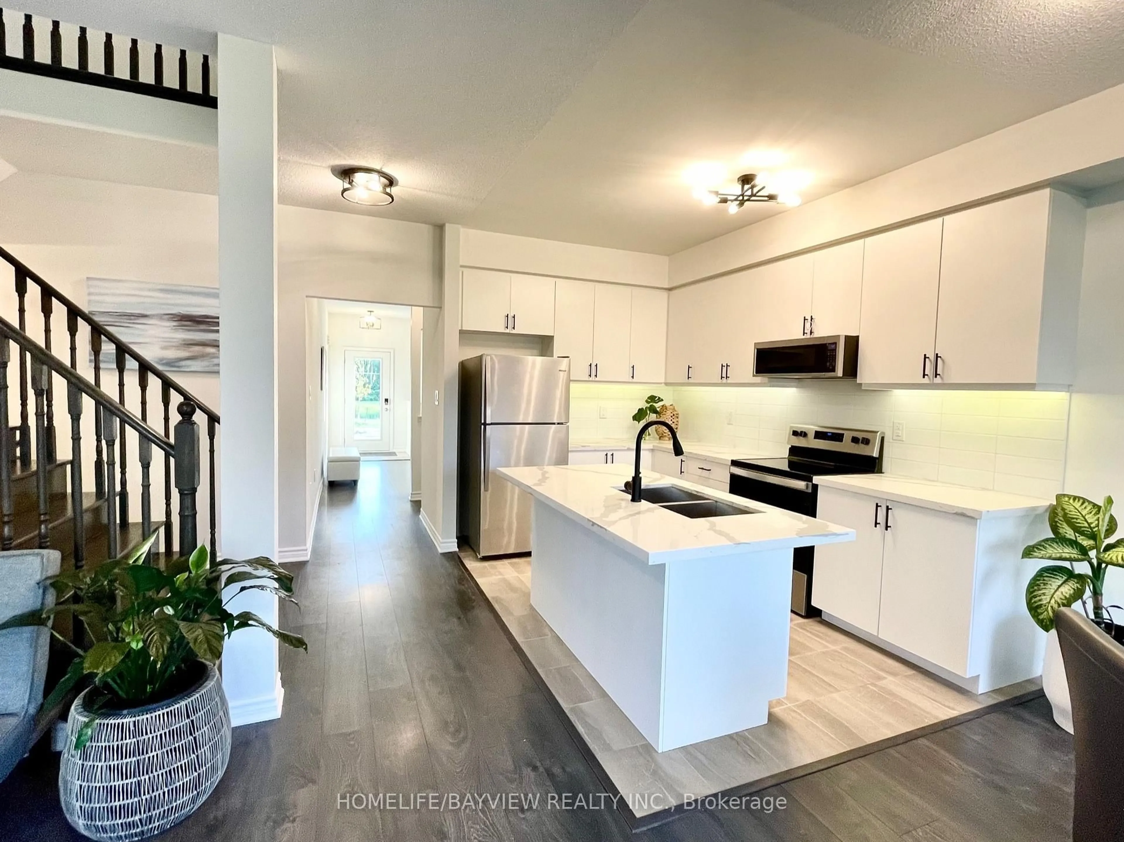 Open concept kitchen, unknown for 128 Village Gate Dr, Wasaga Beach Ontario L9Z 0J7