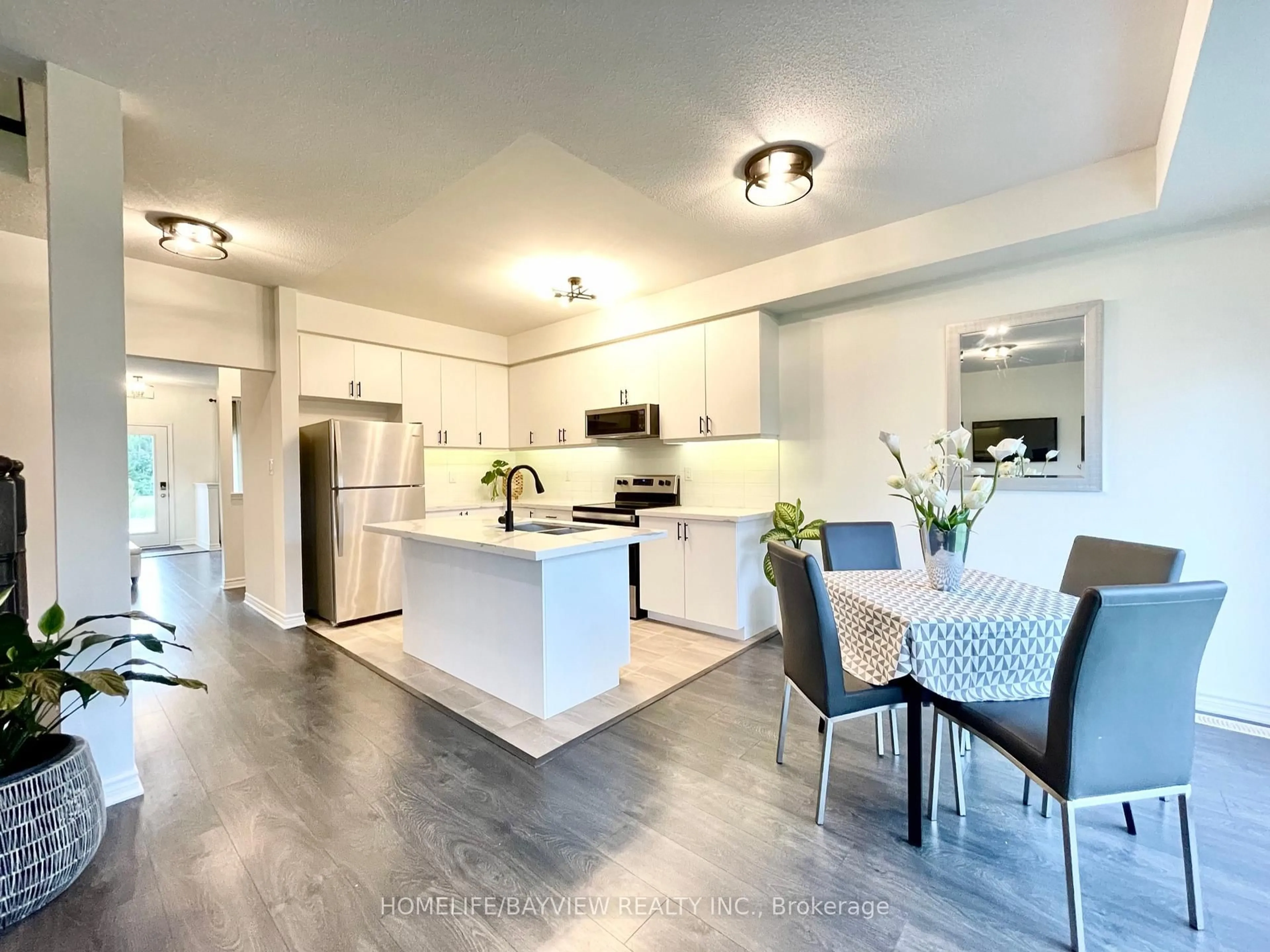 Open concept kitchen, unknown for 128 Village Gate Dr, Wasaga Beach Ontario L9Z 0J7