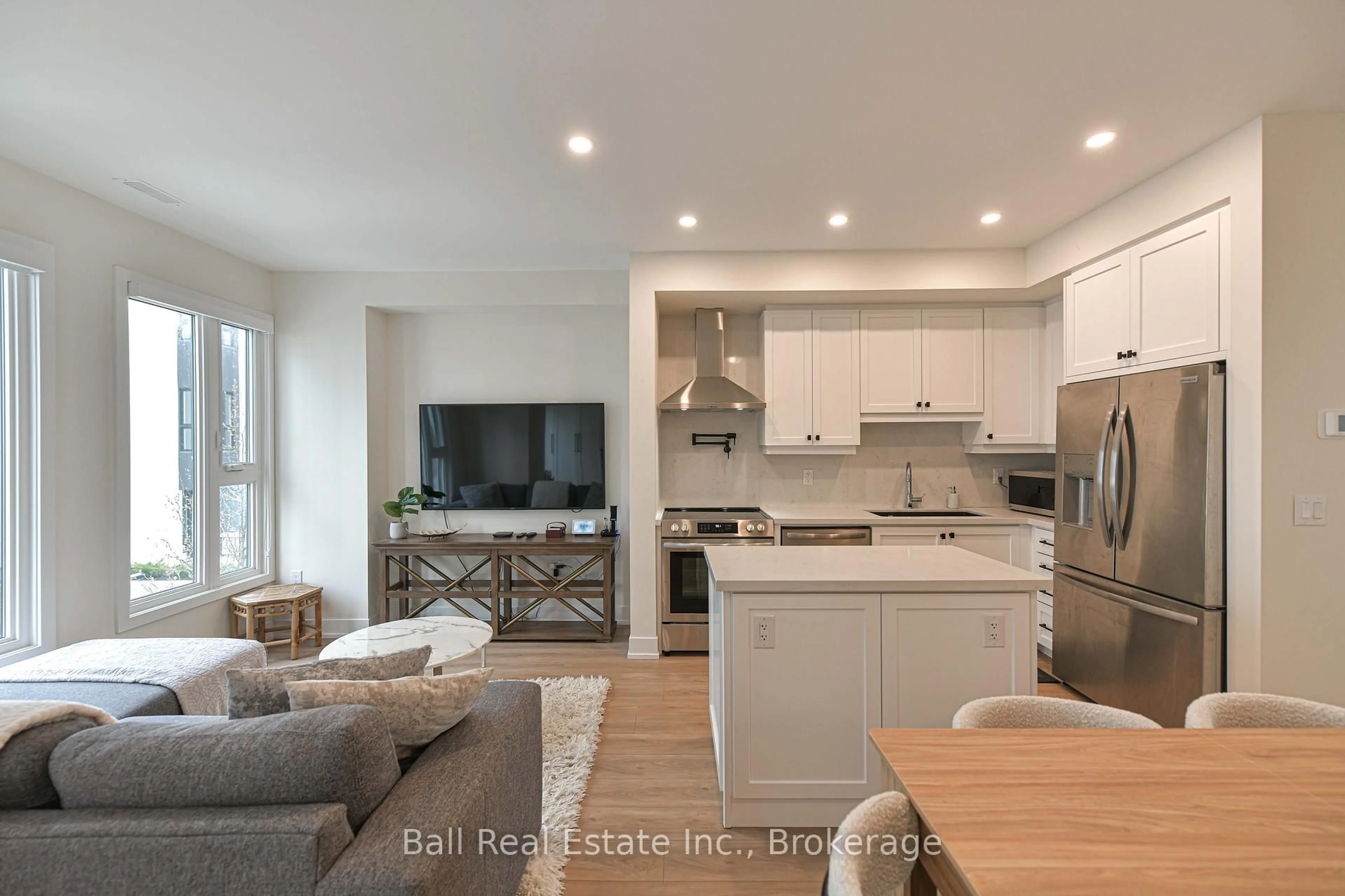 Open concept kitchen, wood/laminate floor for 16 Mariners Pier Way, Orillia Ontario L3V 8P4