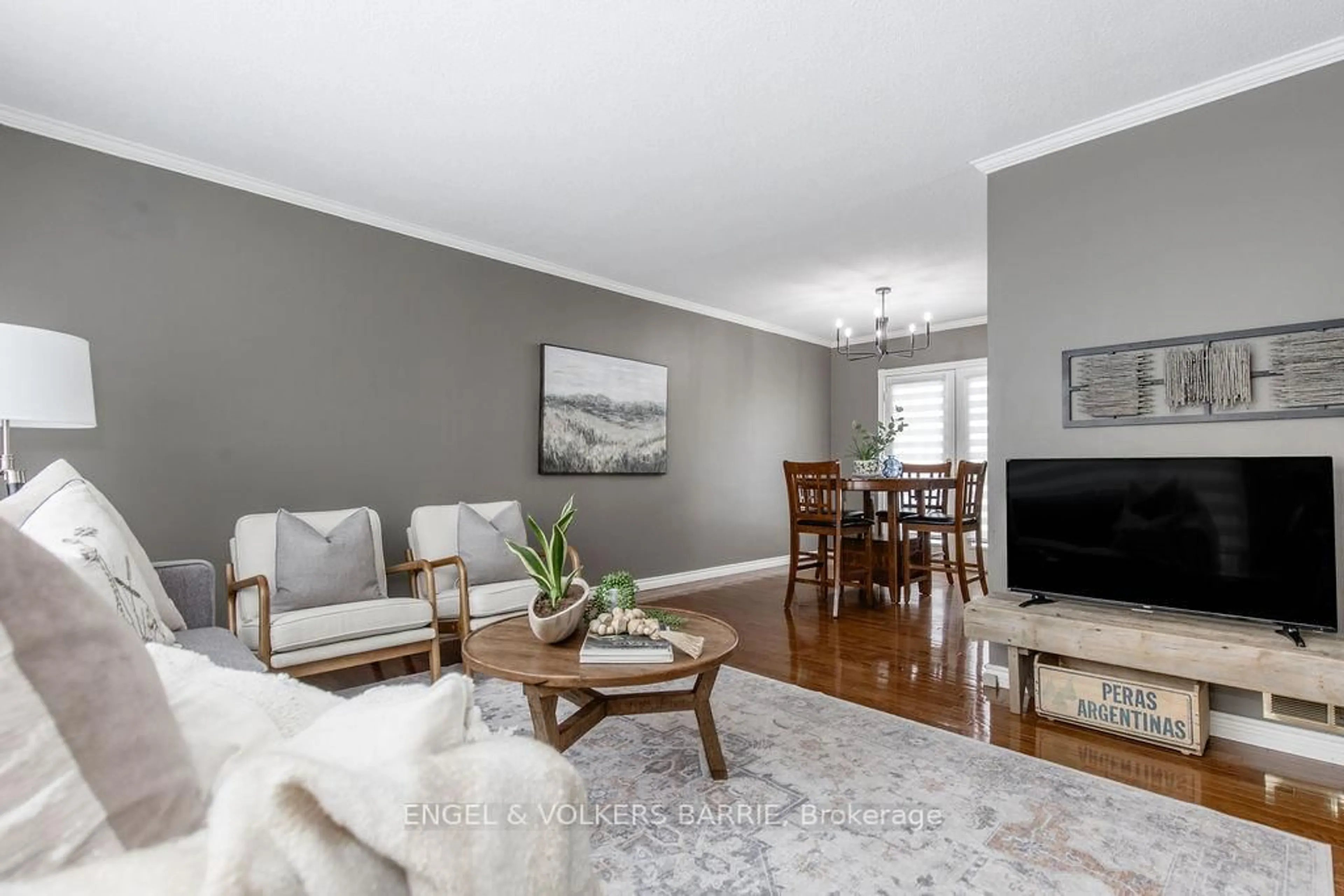 Living room with furniture, wood/laminate floor for 644 Algonquin Dr, Midland Ontario L4R 4R4