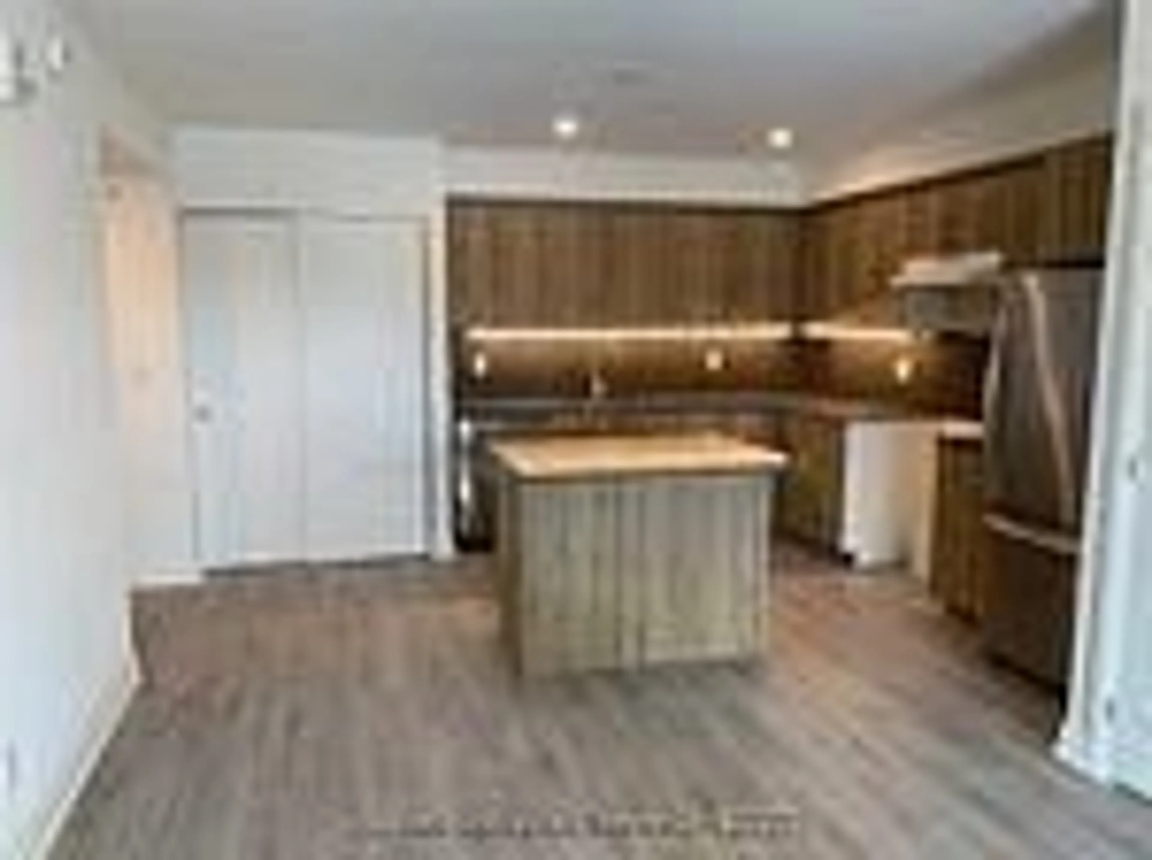 Open concept kitchen, wood/laminate floor for 58 Lakeside Terr #911, Barrie Ontario L4M 0H9