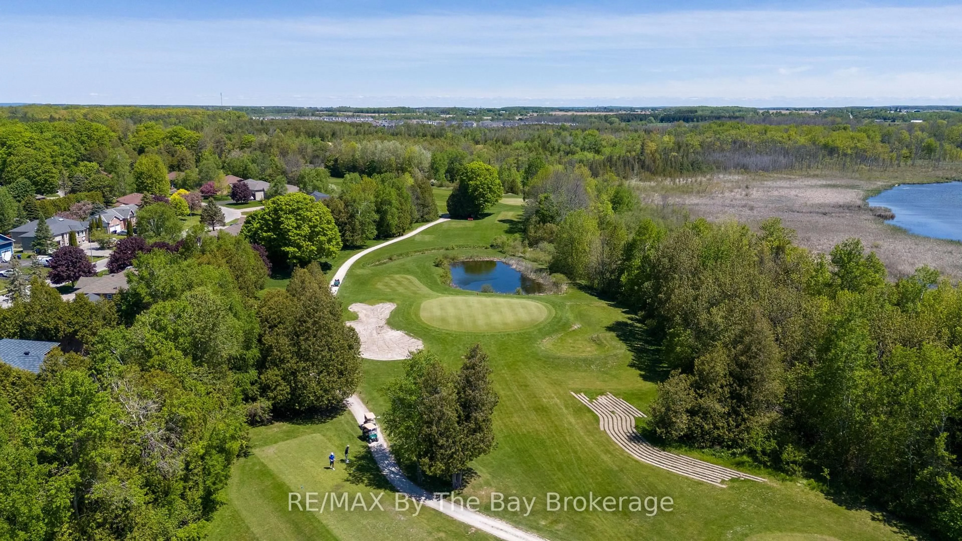 A pic from outside/outdoor area/front of a property/back of a property/a pic from drone, water/lake/river/ocean view for 10 Mulligan Lane #1, Wasaga Beach Ontario L9Z 1C4