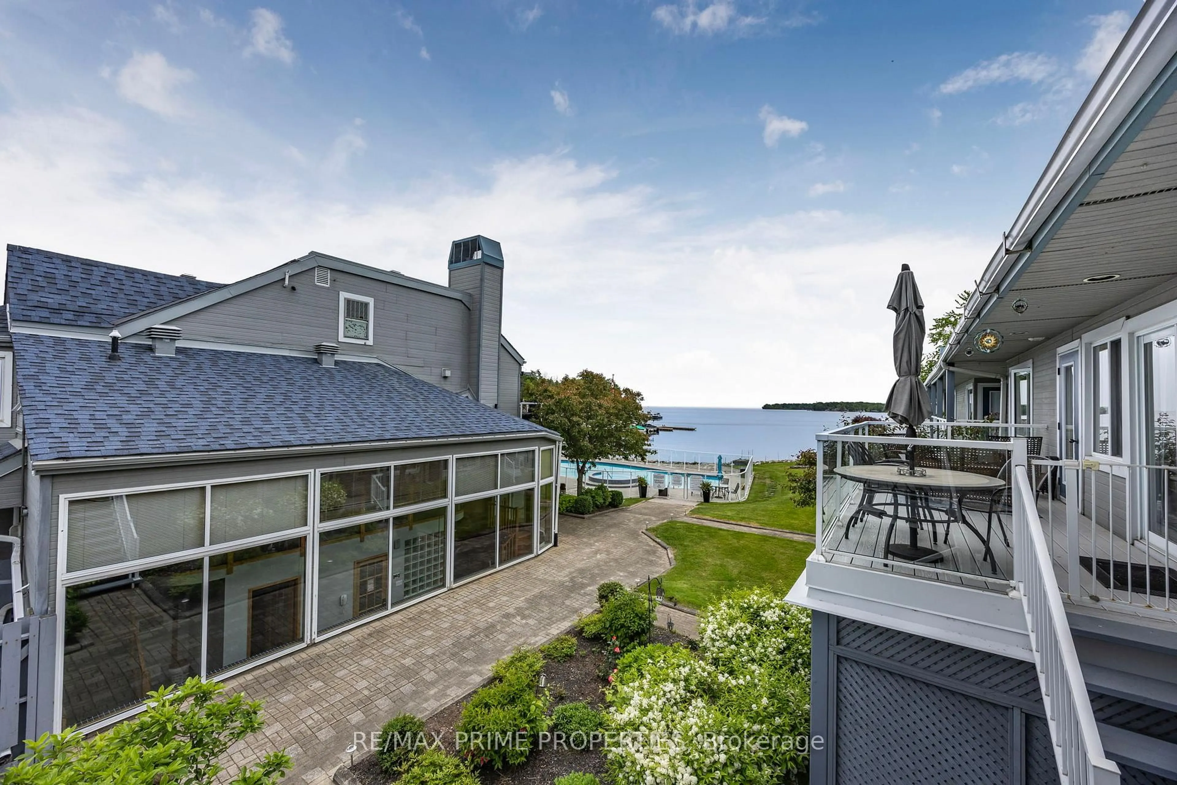 A pic from outside/outdoor area/front of a property/back of a property/a pic from drone, water/lake/river/ocean view for 585 Atherley Rd #201, Orillia Ontario L3V 7L4