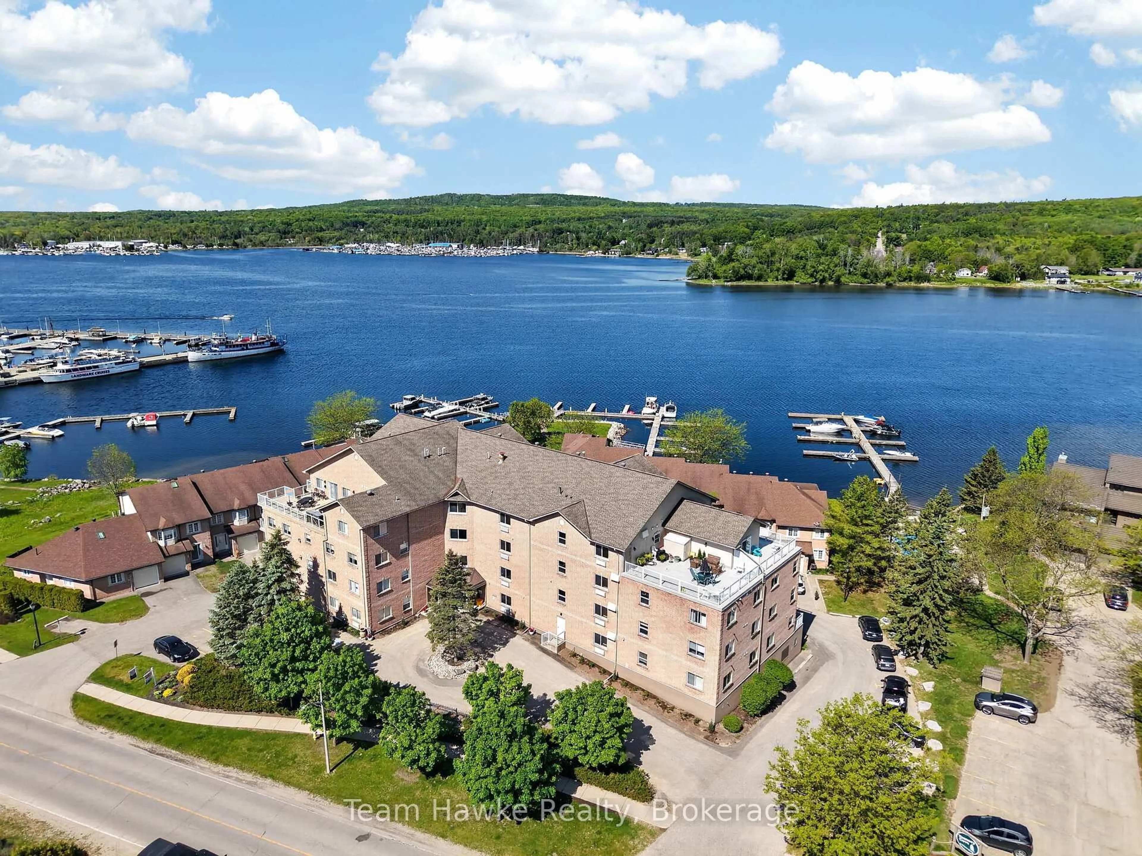 A pic from outside/outdoor area/front of a property/back of a property/a pic from drone, water/lake/river/ocean view for 4 Beck Blvd #PH4, Penetanguishene Ontario L9M 2H3