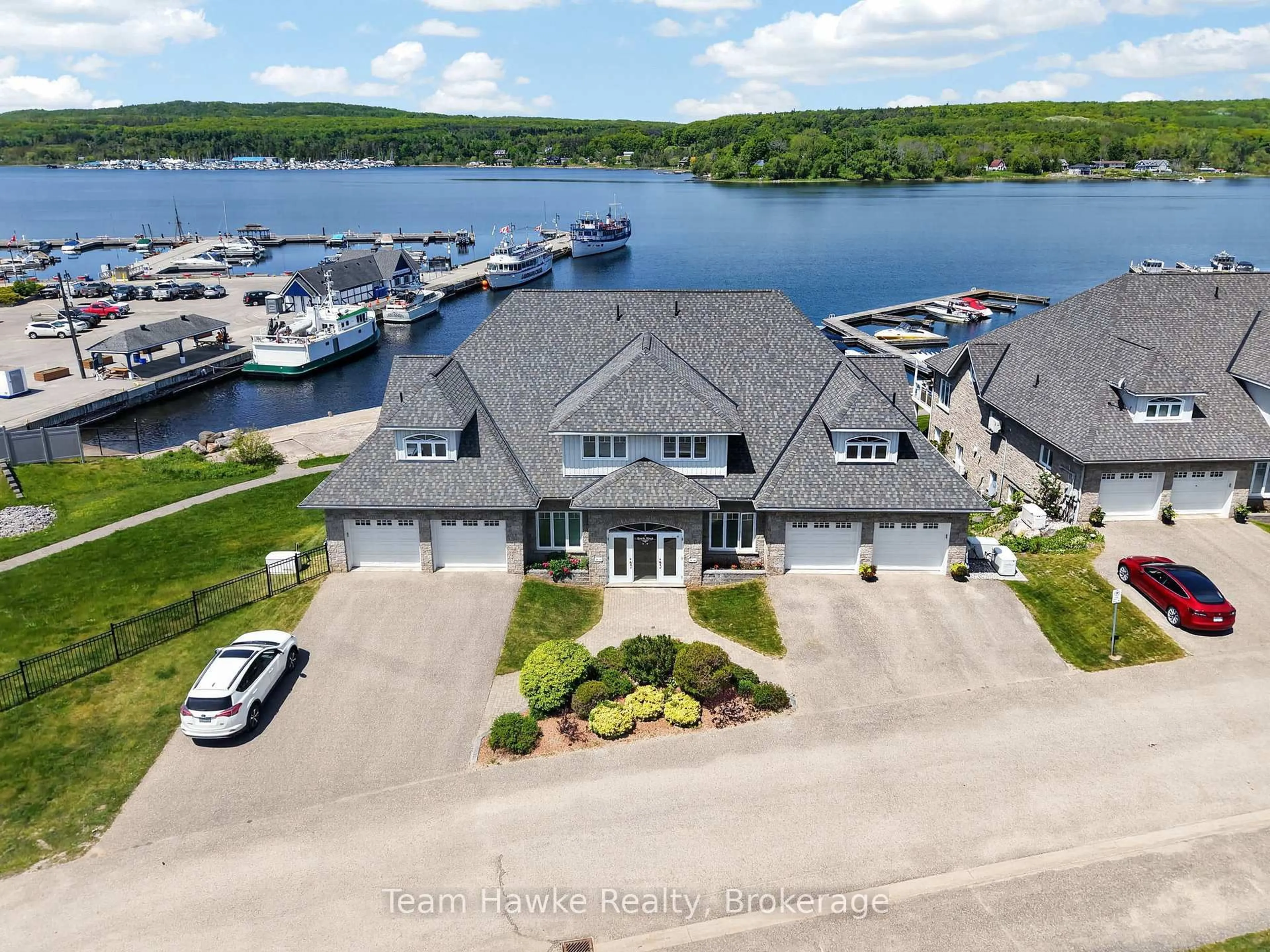 A pic from outside/outdoor area/front of a property/back of a property/a pic from drone, water/lake/river/ocean view for 2 Beck Blvd #8, Penetanguishene Ontario L9M 2J4