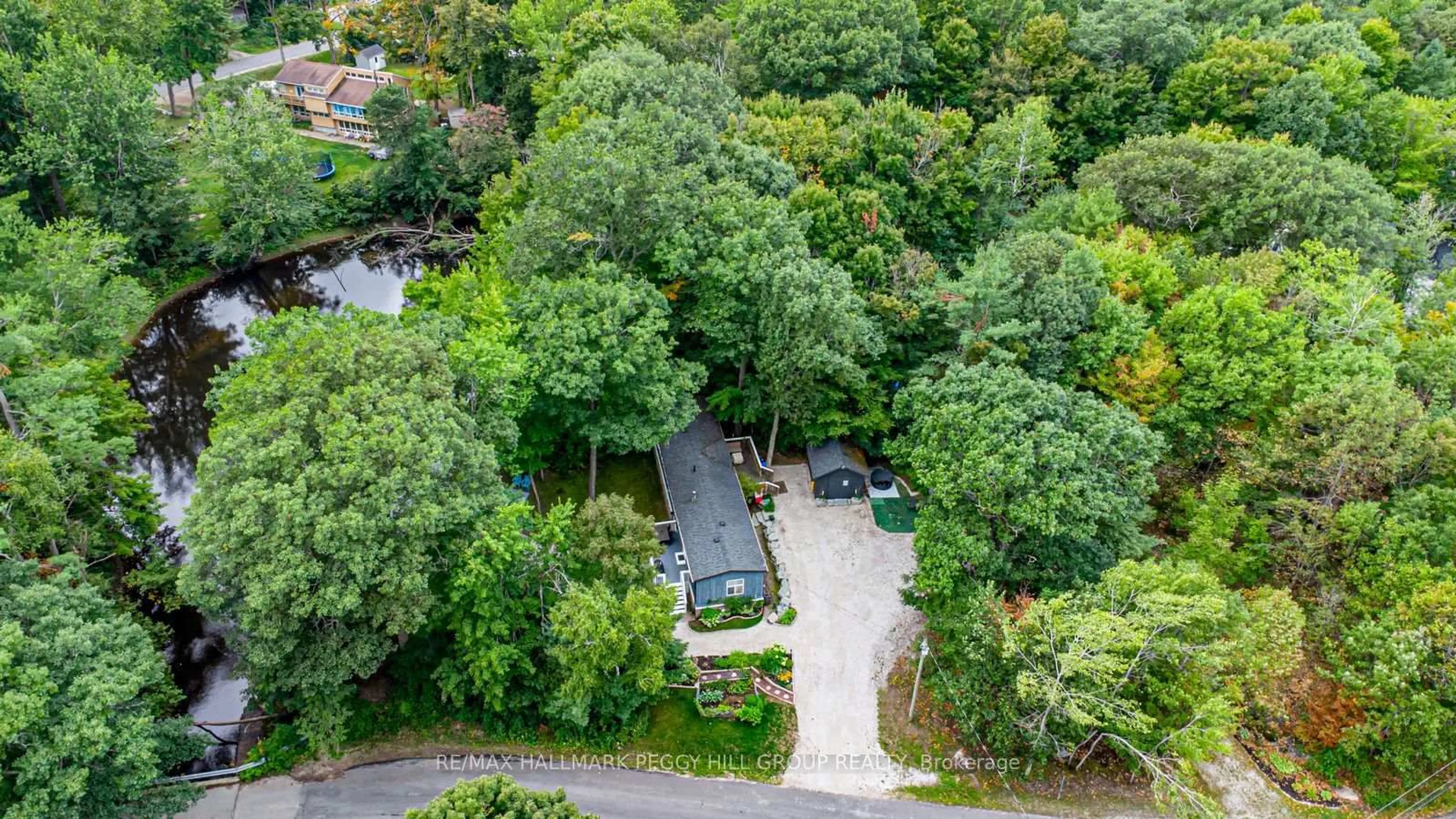 A pic from outside/outdoor area/front of a property/back of a property/a pic from drone, street for 7498 Island Cres, Ramara Ontario L0K 2B0