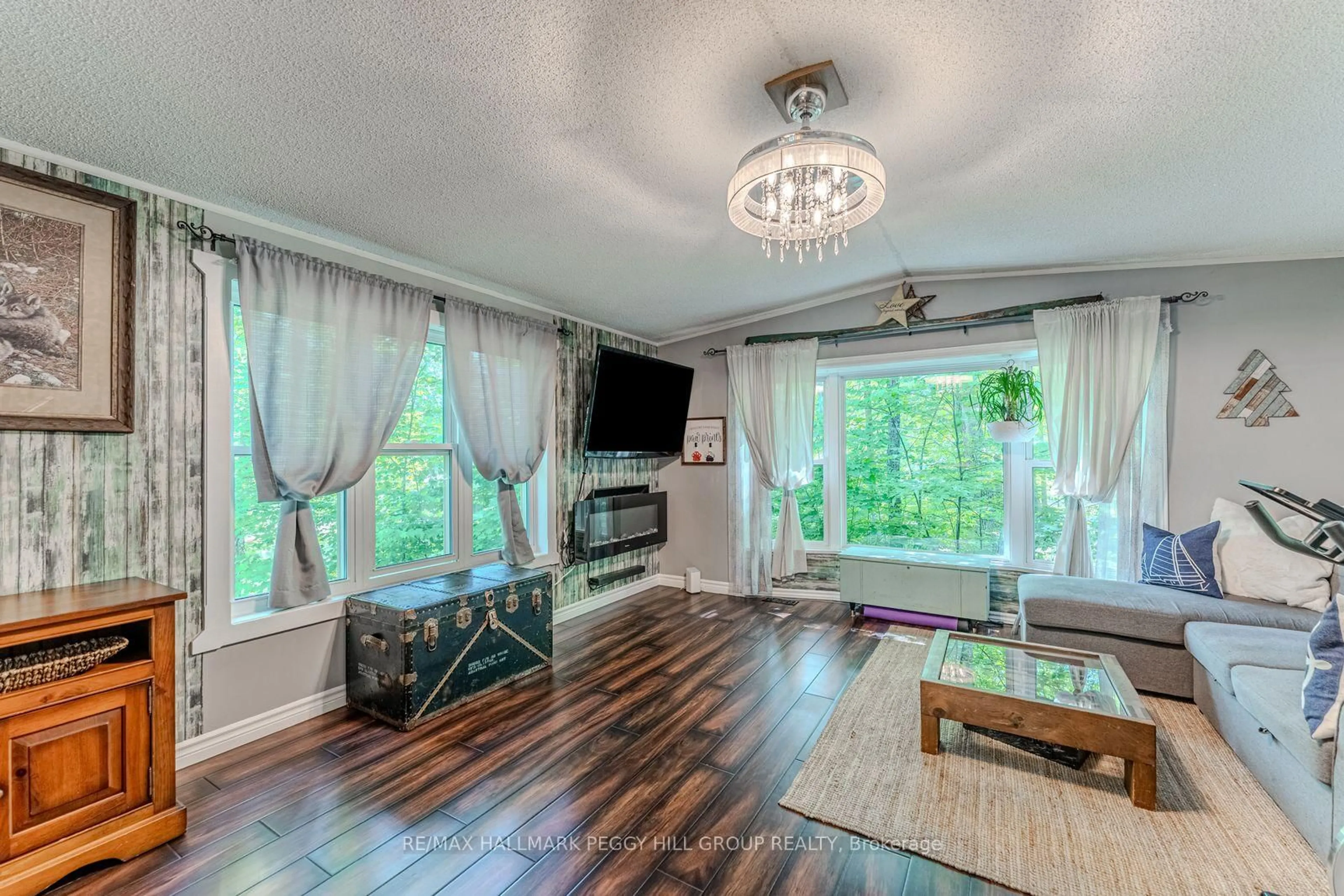 Living room with furniture, wood/laminate floor for 7498 Island Cres, Ramara Ontario L0K 2B0