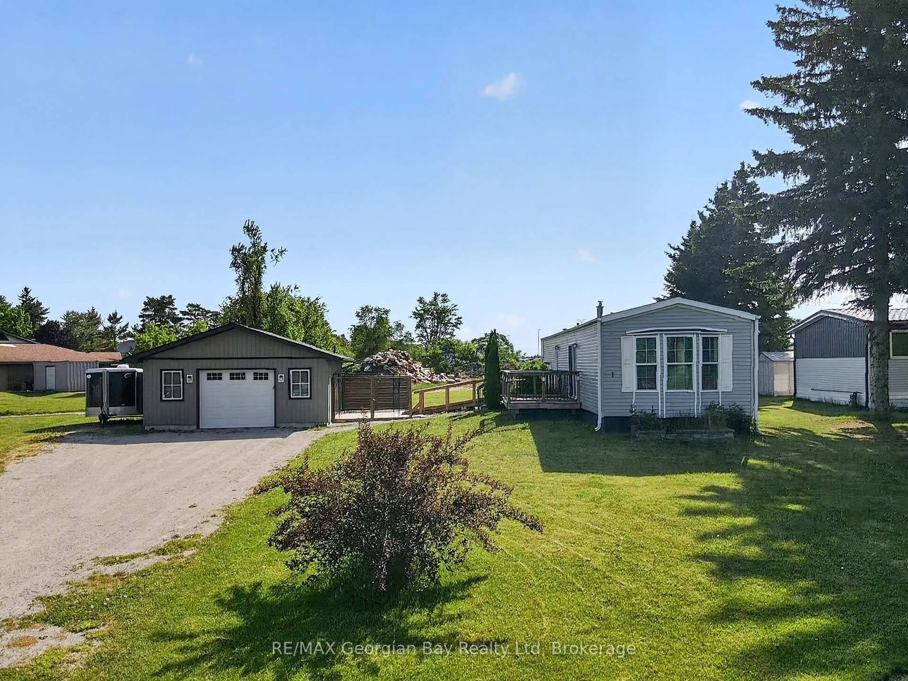 A pic from outside/outdoor area/front of a property/back of a property/a pic from drone, water/lake/river/ocean view for 1 Maple Lane, Midland Ontario L4R 0B9