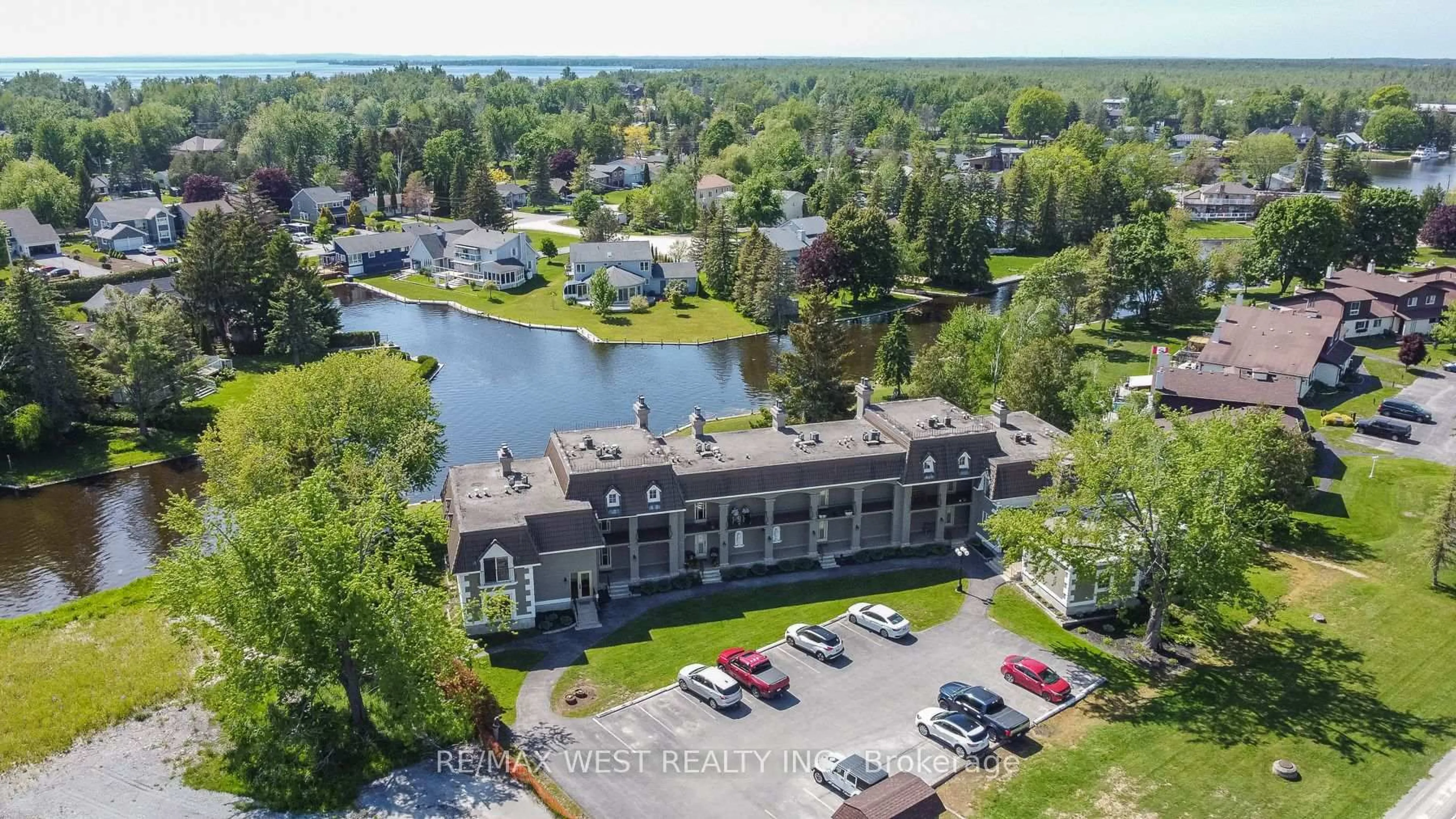 A pic from outside/outdoor area/front of a property/back of a property/a pic from drone, water/lake/river/ocean view for 60 Laguna Pkwy #16, Ramara Ontario L0K 1B0