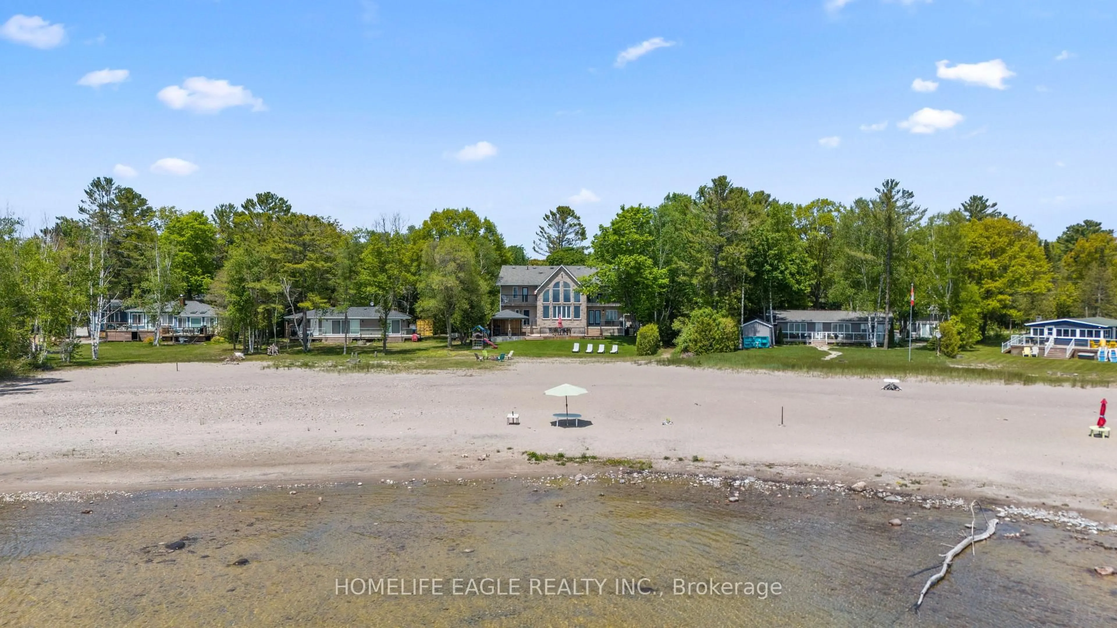 A pic from outside/outdoor area/front of a property/back of a property/a pic from drone, water/lake/river/ocean view for 1496 Tiny Beaches Rd, Tiny Ontario L9M 0J2