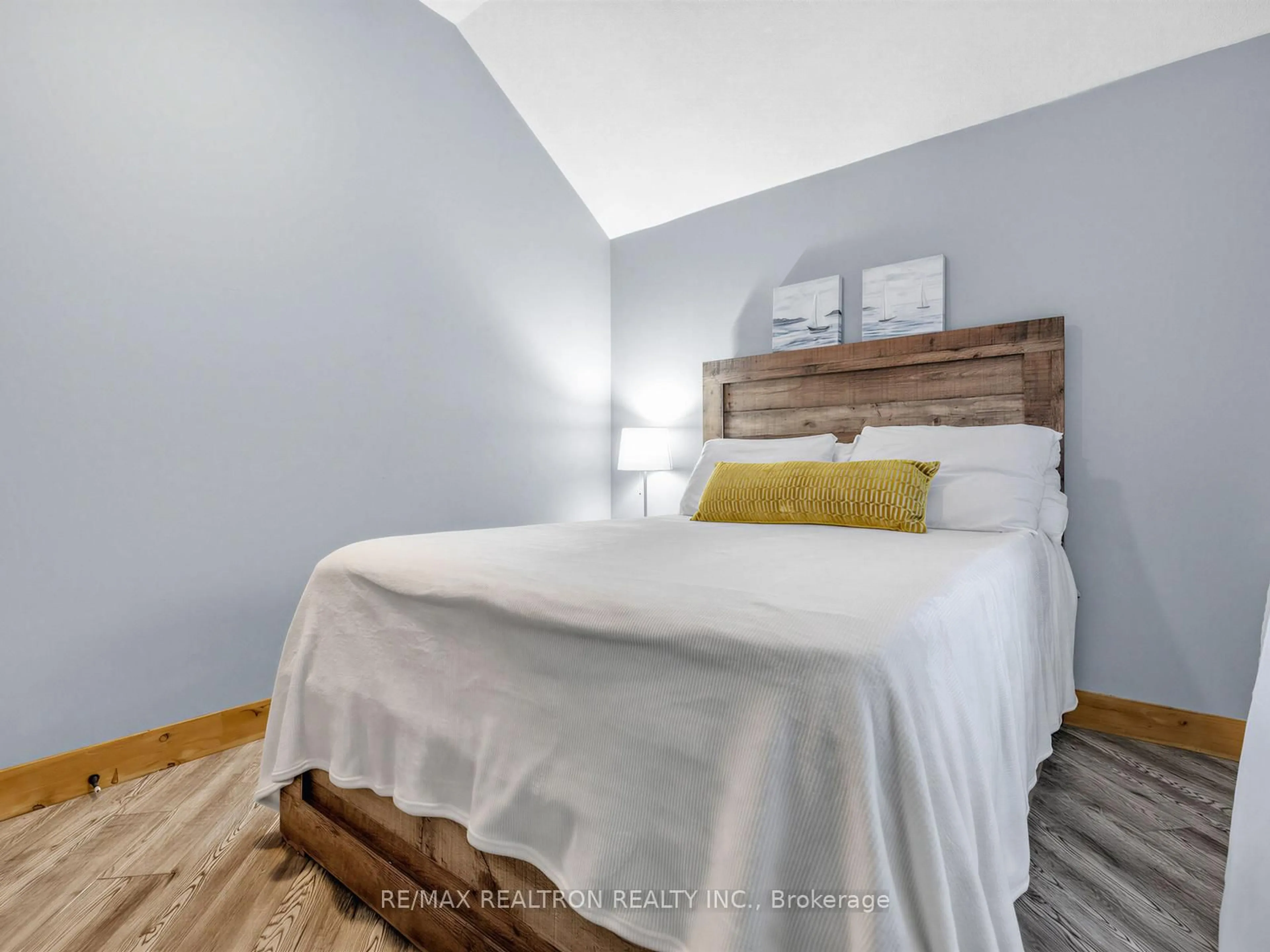 Bedroom with bed, wood/laminate floor for 4705 Anderson Ave, Ramara Ontario L3V 6H7