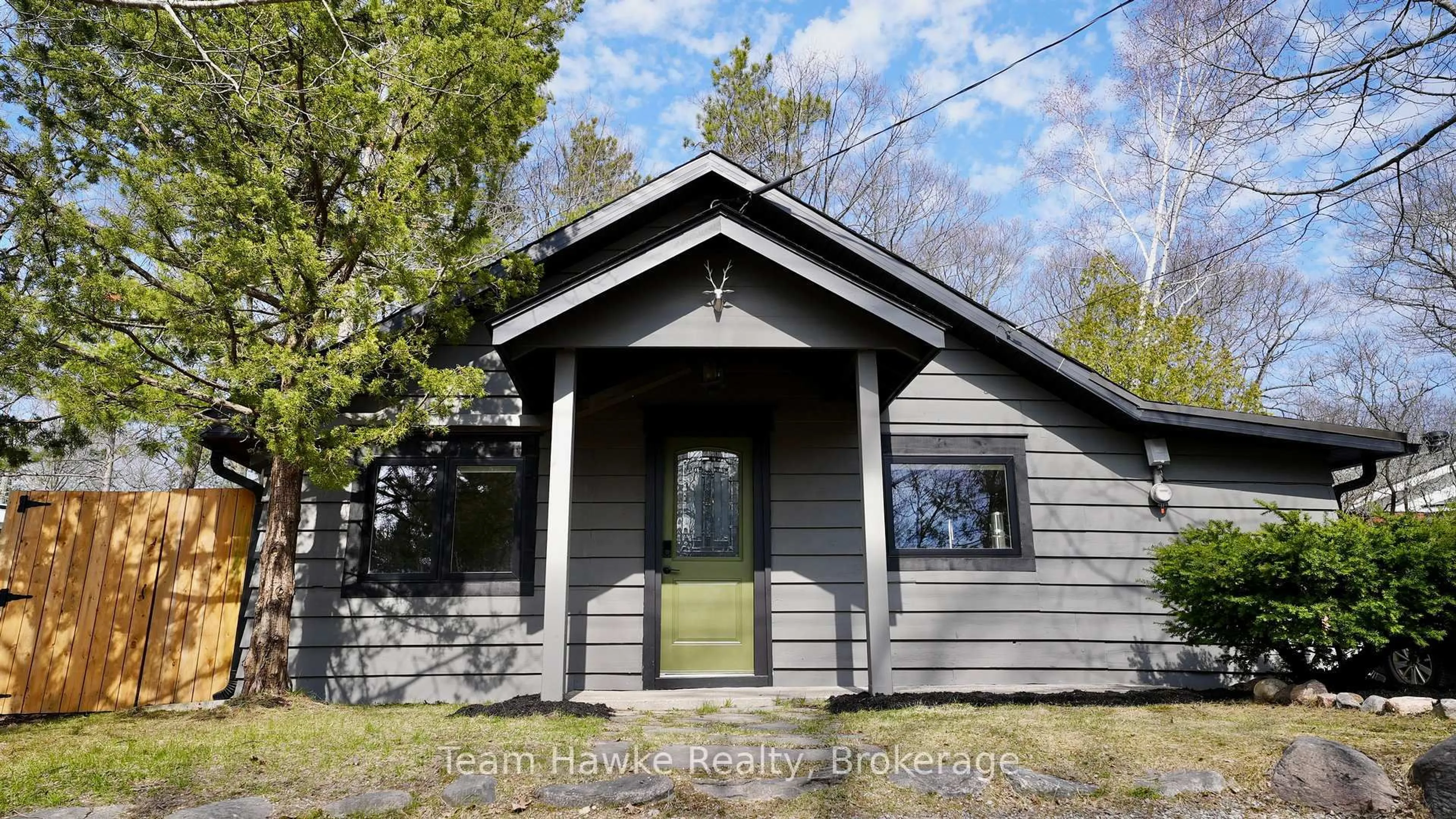 Home with vinyl exterior material, street for 283 Tiny Beaches Rd, Tiny Ontario L0L 2J0