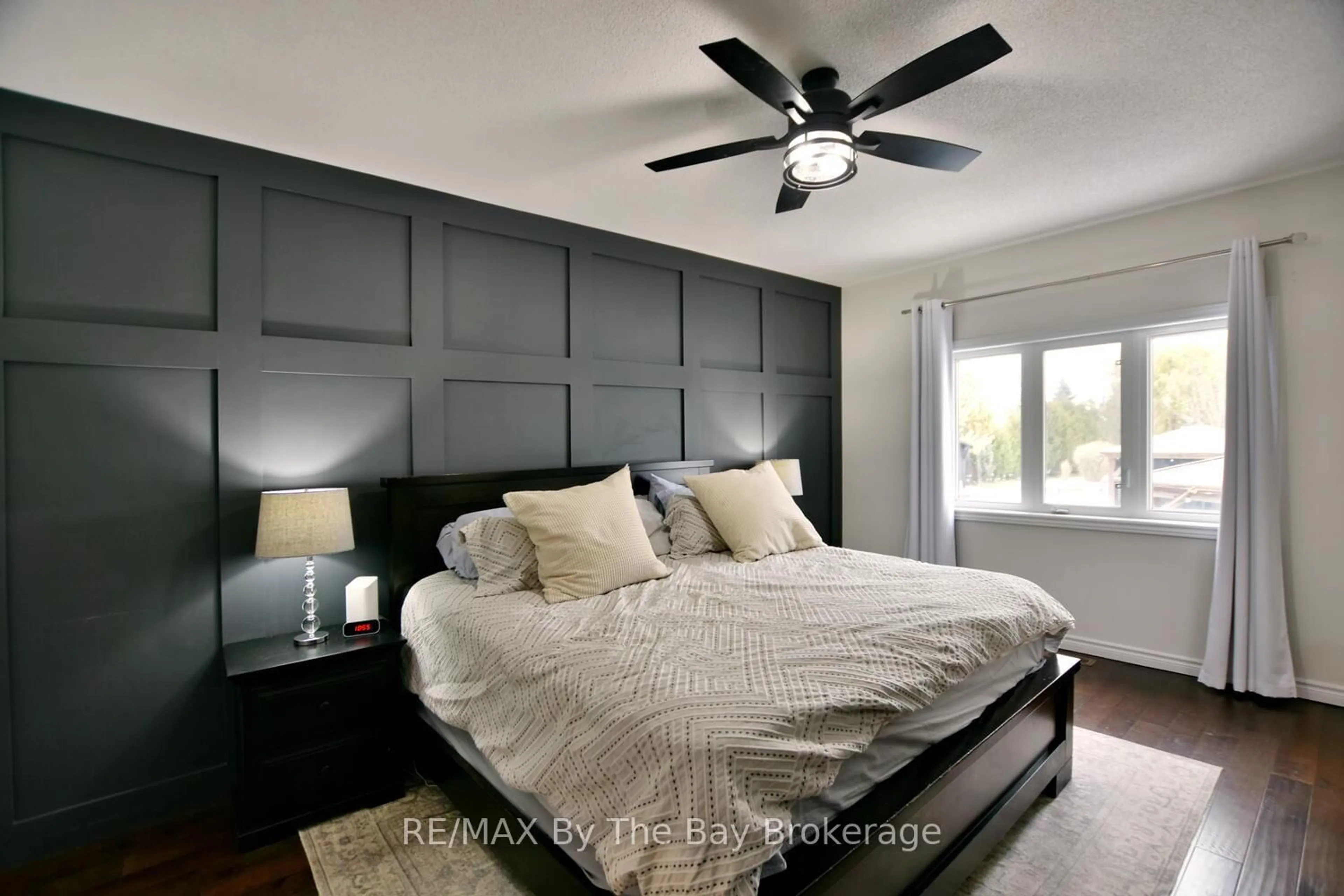Bedroom with bed, wood/laminate floor for 17 Basswood Dr, Wasaga Beach Ontario L9Z 0A8