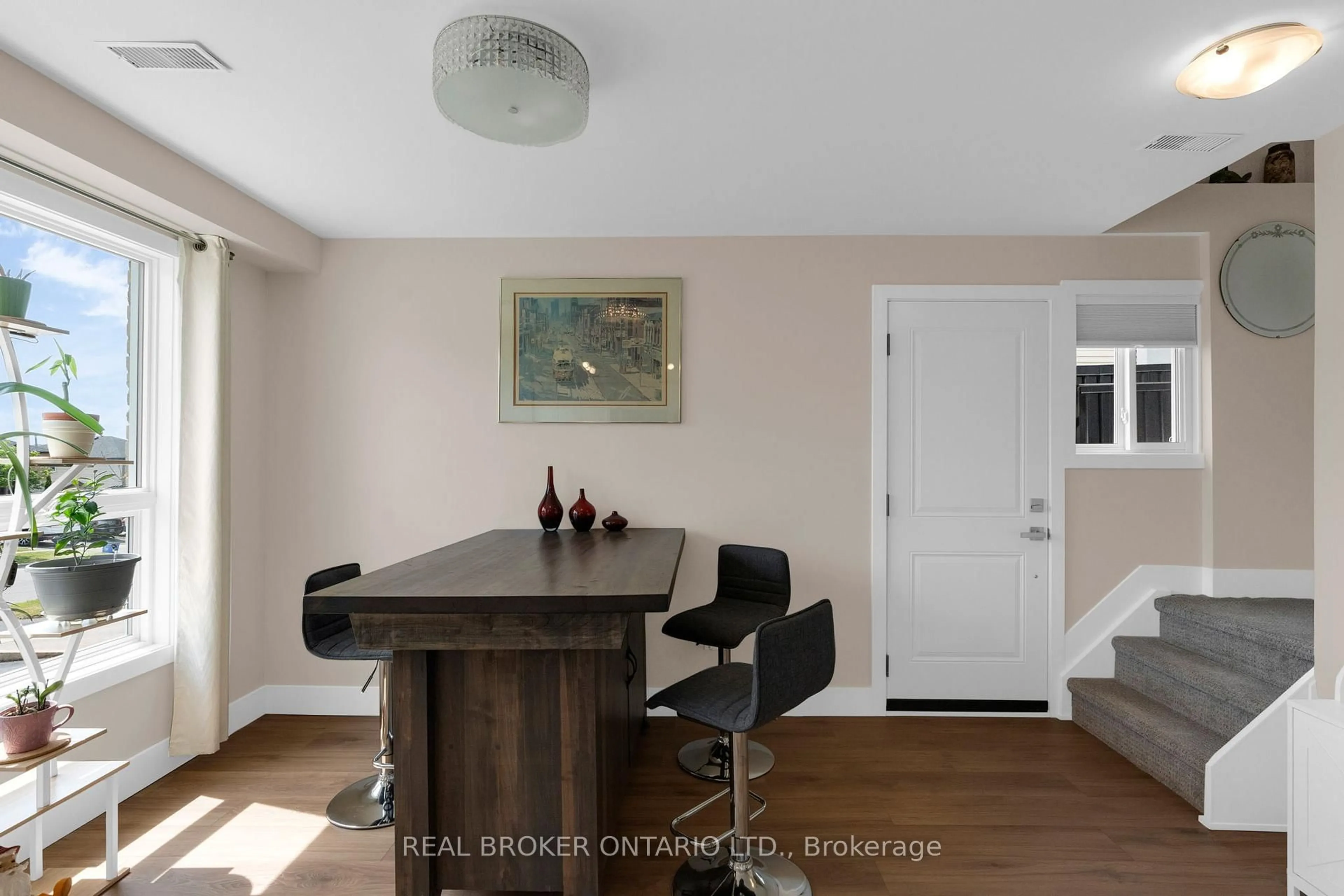 Dining room, wood/laminate floor for 50 Browning Tr, Barrie Ontario L4N 4Z5