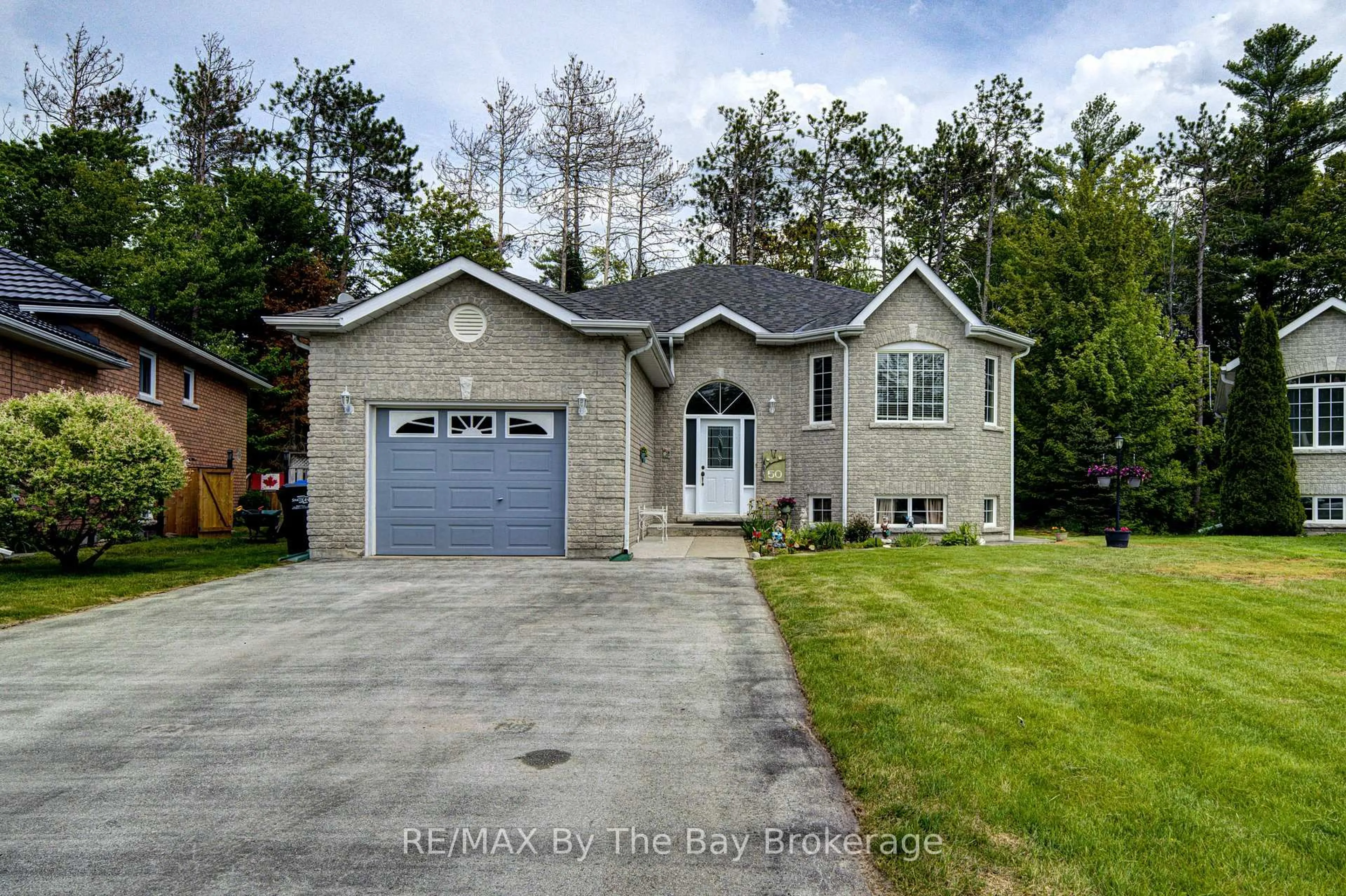 Home with brick exterior material, street for 50 Donato Way, Wasaga Beach Ontario L9Z 1R9