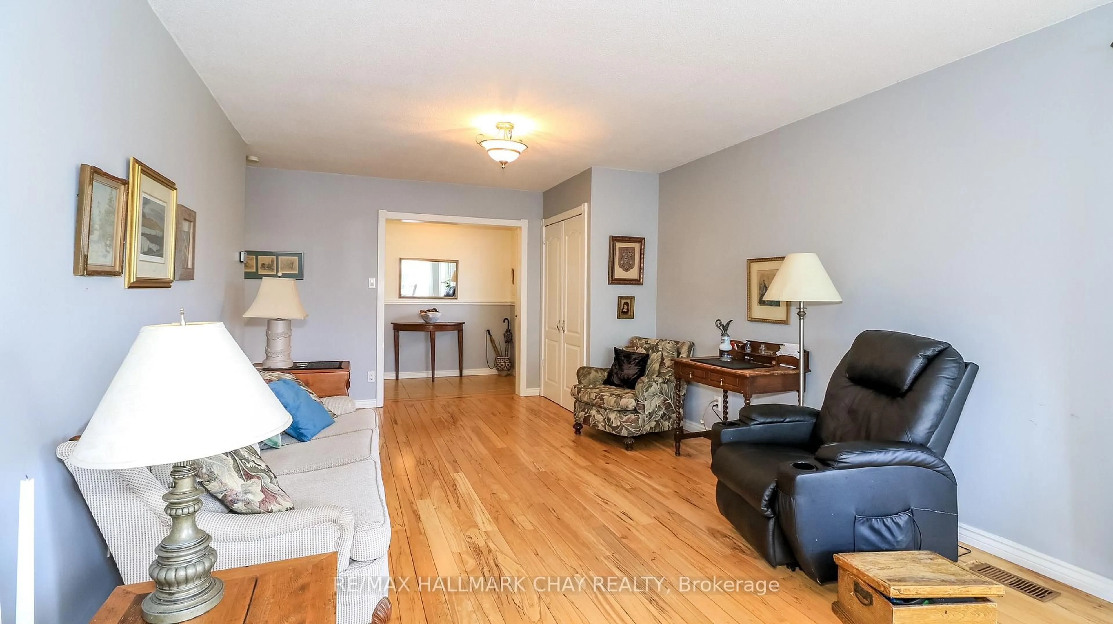 Living room with furniture, wood/laminate floor for 15 Murray St, Orillia Ontario L3V 2L8