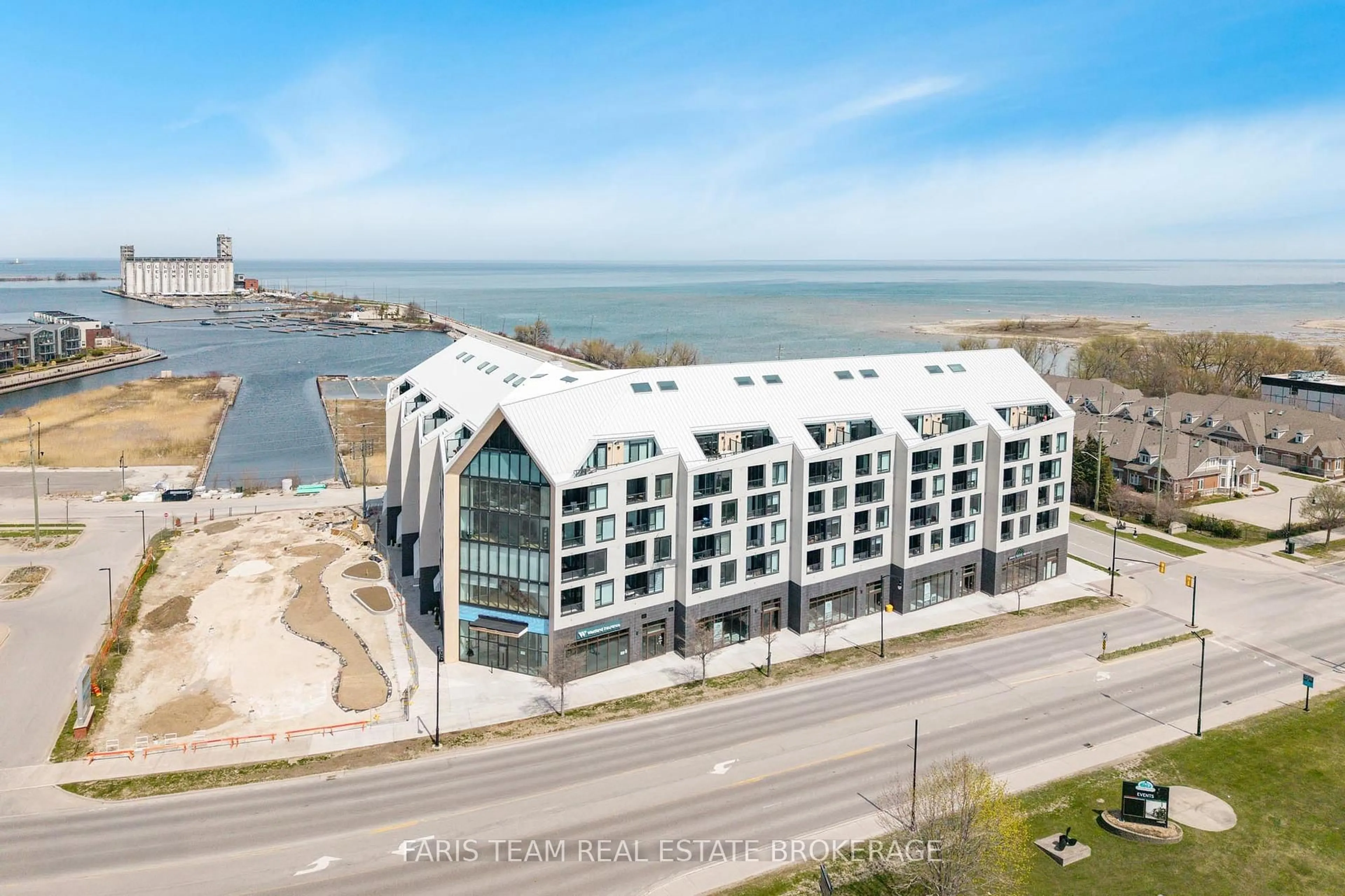 A pic from outside/outdoor area/front of a property/back of a property/a pic from drone, water/lake/river/ocean view for 31 Huron St #209, Collingwood Ontario L9Y 1C3