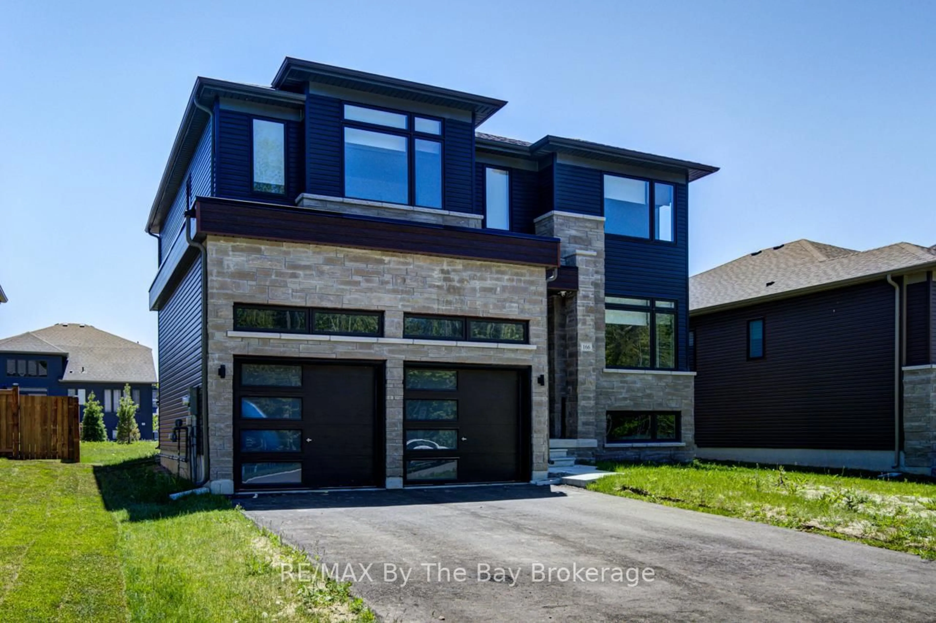 Home with brick exterior material, street for 166 Mapleside Dr, Wasaga Beach Ontario L9Z 3A5