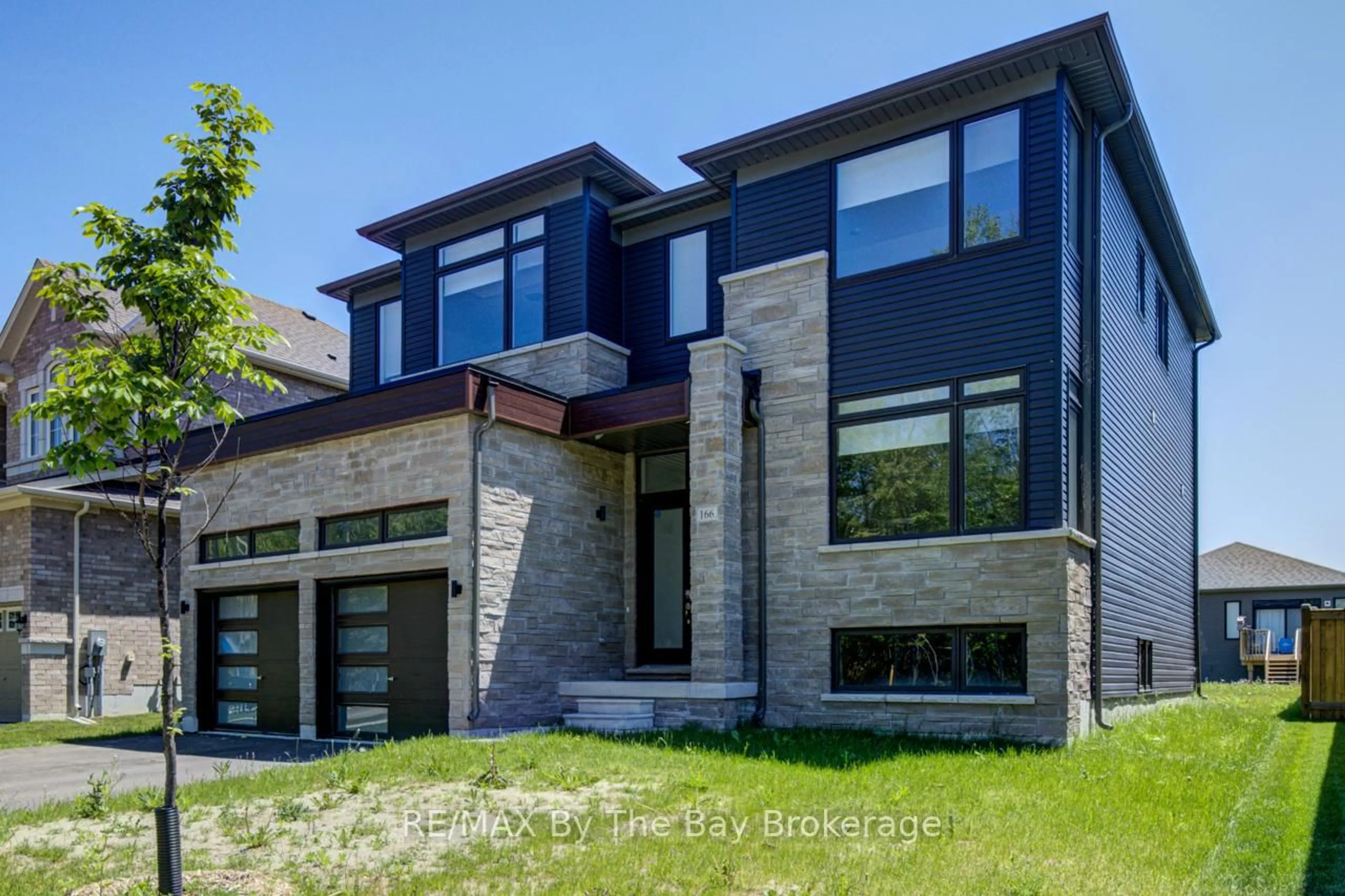 Home with brick exterior material, street for 166 Mapleside Dr, Wasaga Beach Ontario L9Z 3A5