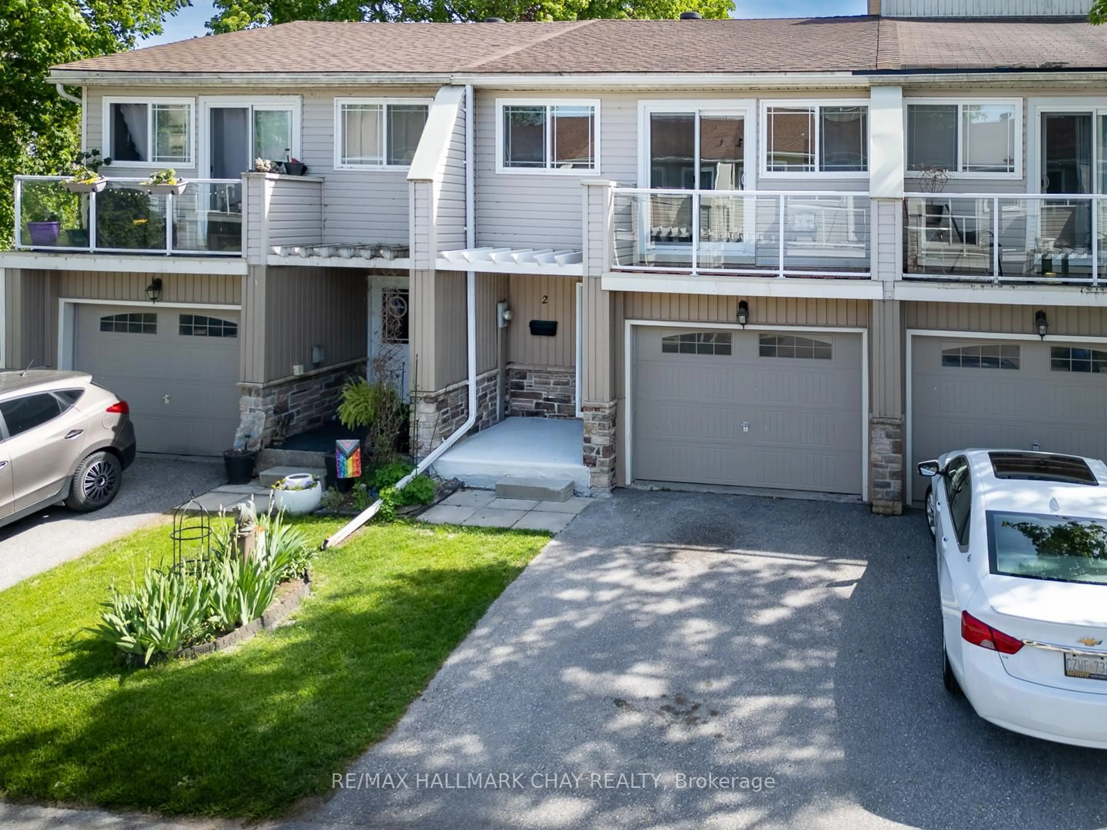 A pic from outside/outdoor area/front of a property/back of a property/a pic from drone, street for 12 Lankin Blvd #2, Orillia Ontario L3V 6T2