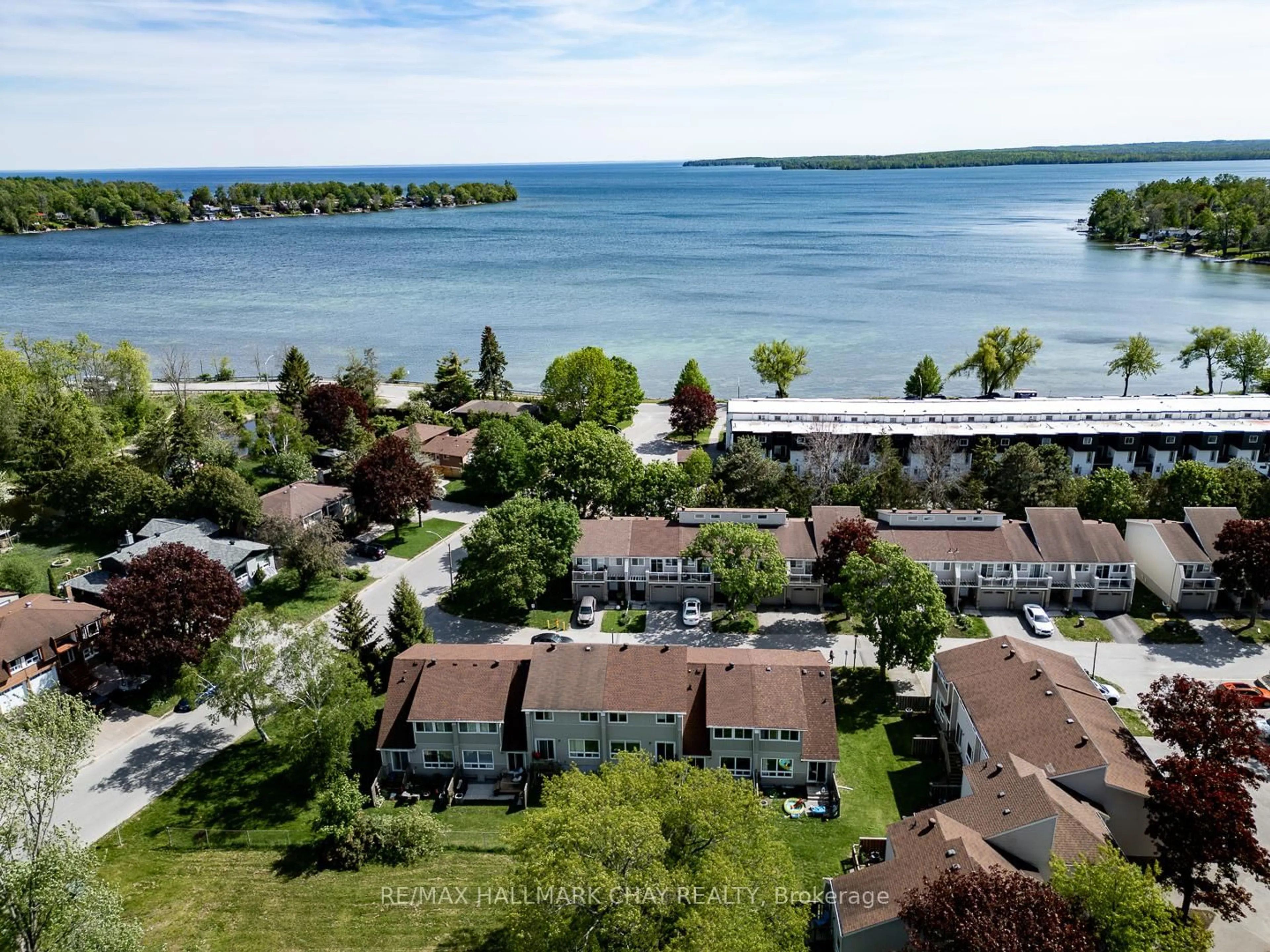 A pic from outside/outdoor area/front of a property/back of a property/a pic from drone, water/lake/river/ocean view for 12 Lankin Blvd #2, Orillia Ontario L3V 6T2