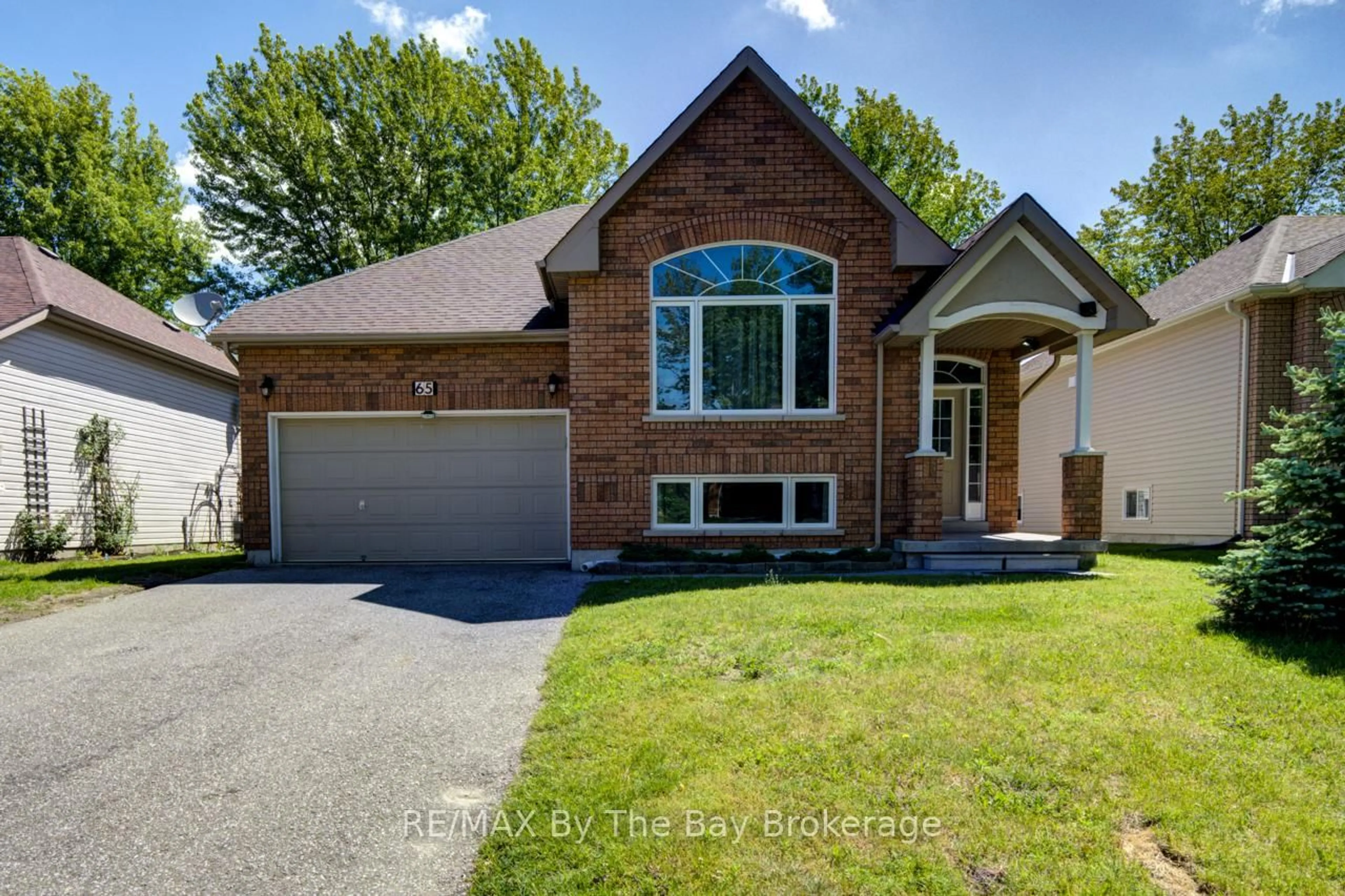 Home with brick exterior material, street for 65 Rose Valley Way, Wasaga Beach Ontario L9Z 3C4