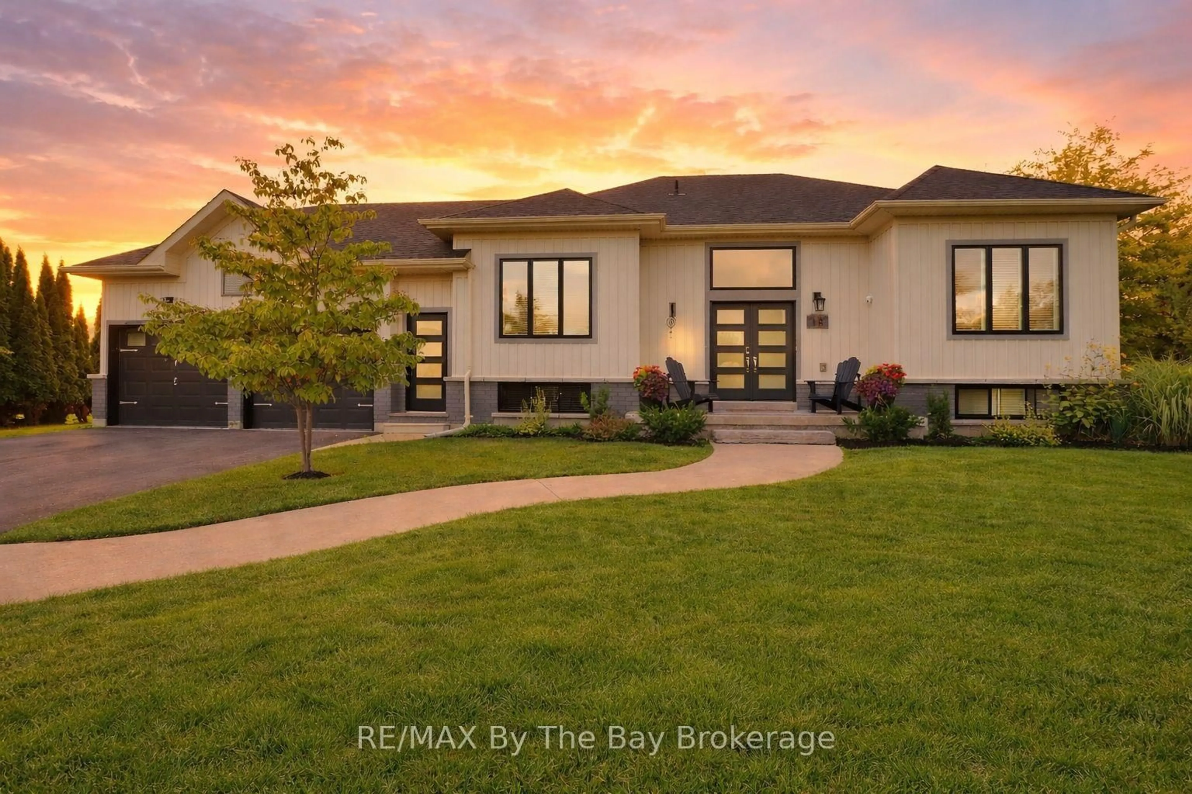 Home with brick exterior material, street for 18 Maple Dr, Wasaga Beach Ontario L9Z 0A7