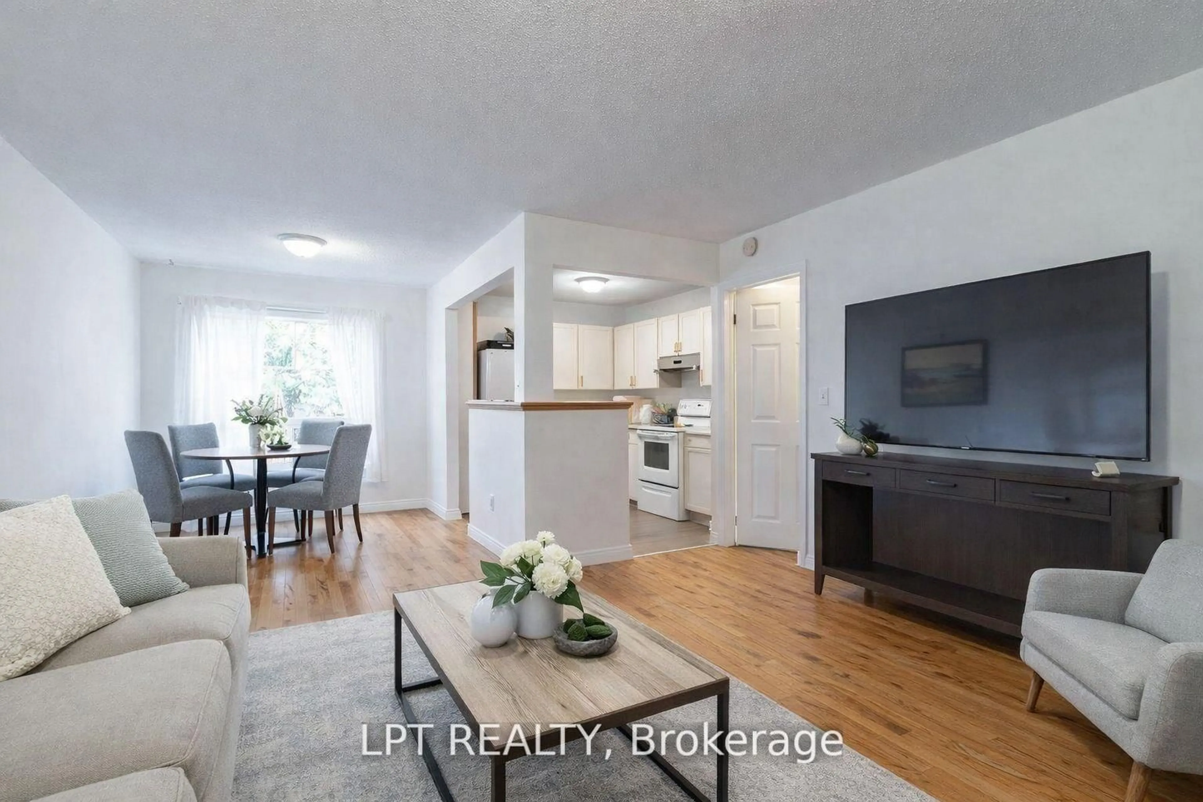 Living room with furniture, wood/laminate floor for 342 Linwood Ave, Orillia Ontario L3V 2X1