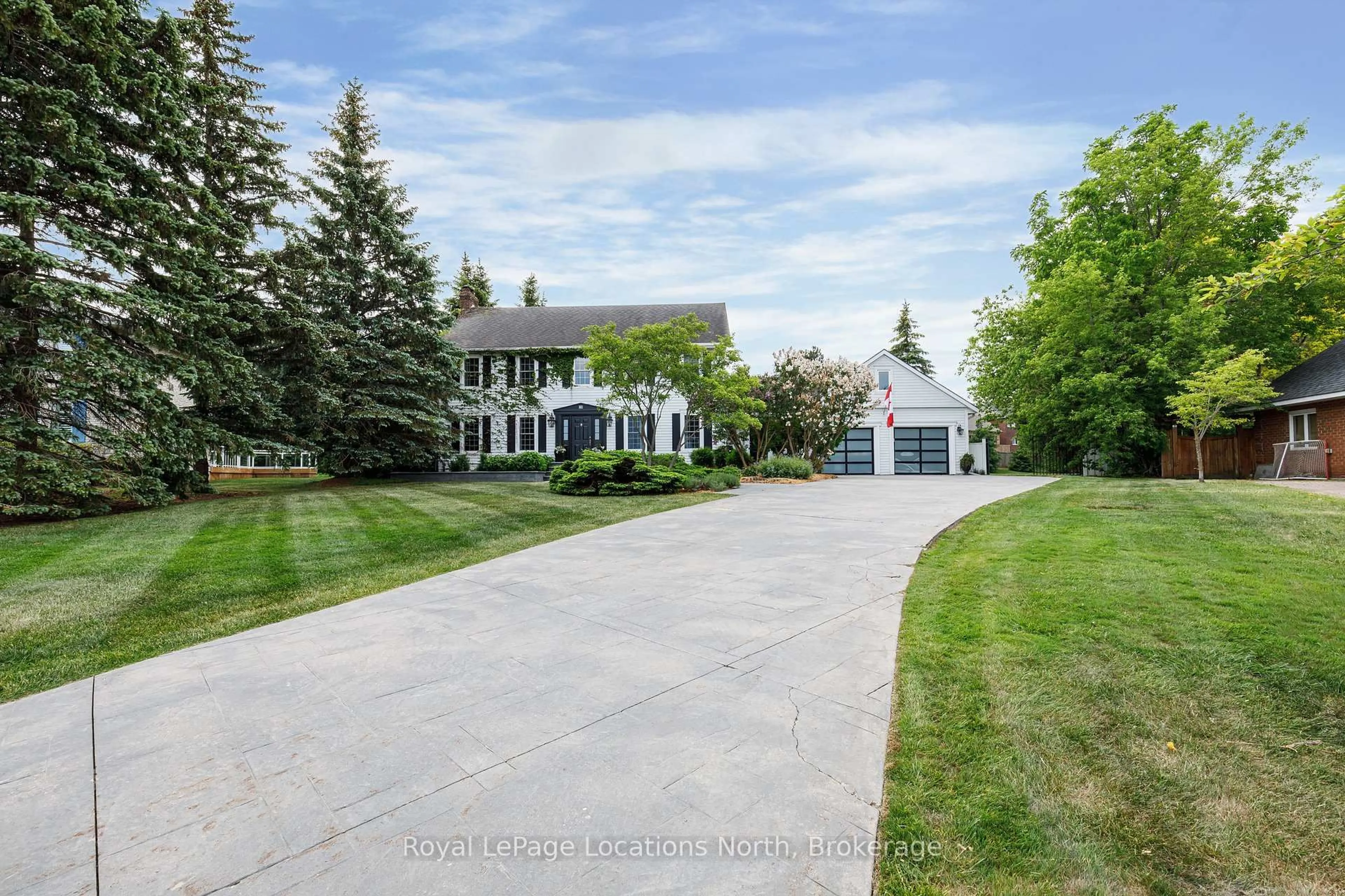 A pic from outside/outdoor area/front of a property/back of a property/a pic from drone, street for 42 Lockhart Rd, Collingwood Ontario L9Y 2L3