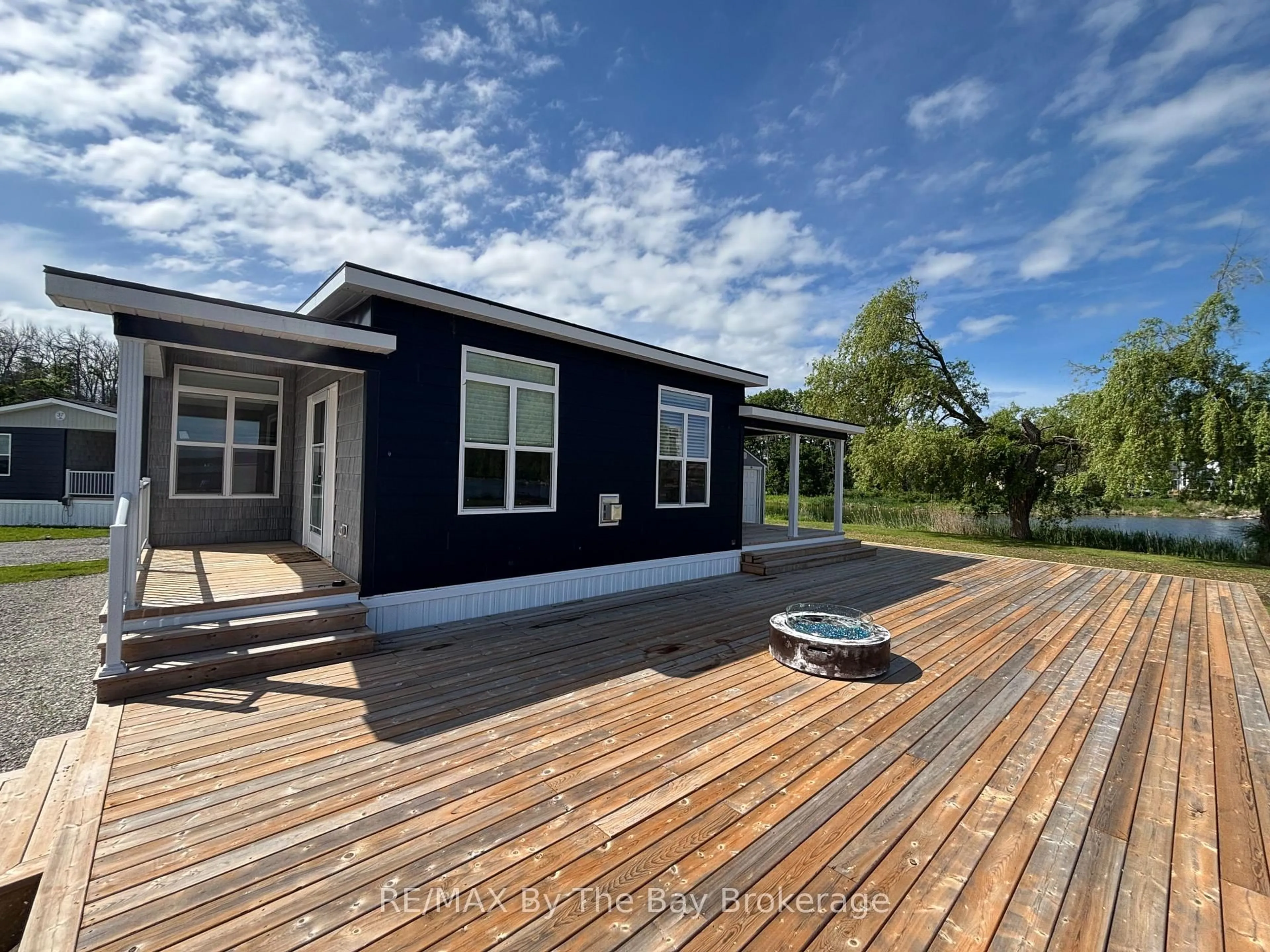 A pic from outside/outdoor area/front of a property/back of a property/a pic from drone, water/lake/river/ocean view for 3282 Ogden's Beach Rd #38, Tay Ontario L9S 2K6