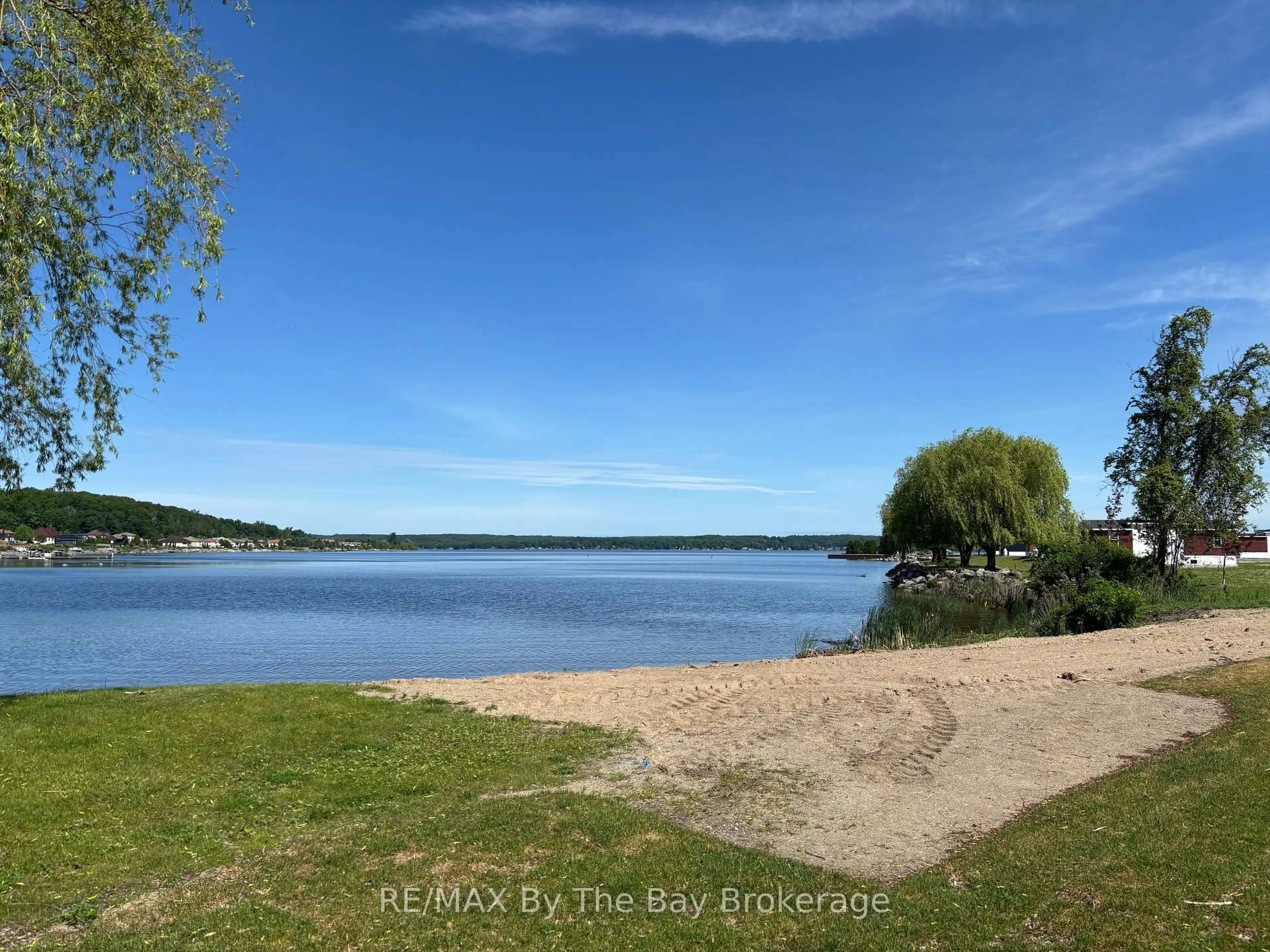 A pic from outside/outdoor area/front of a property/back of a property/a pic from drone, water/lake/river/ocean view for 3282 Ogden's Beach Rd #38, Tay Ontario L9S 2K6