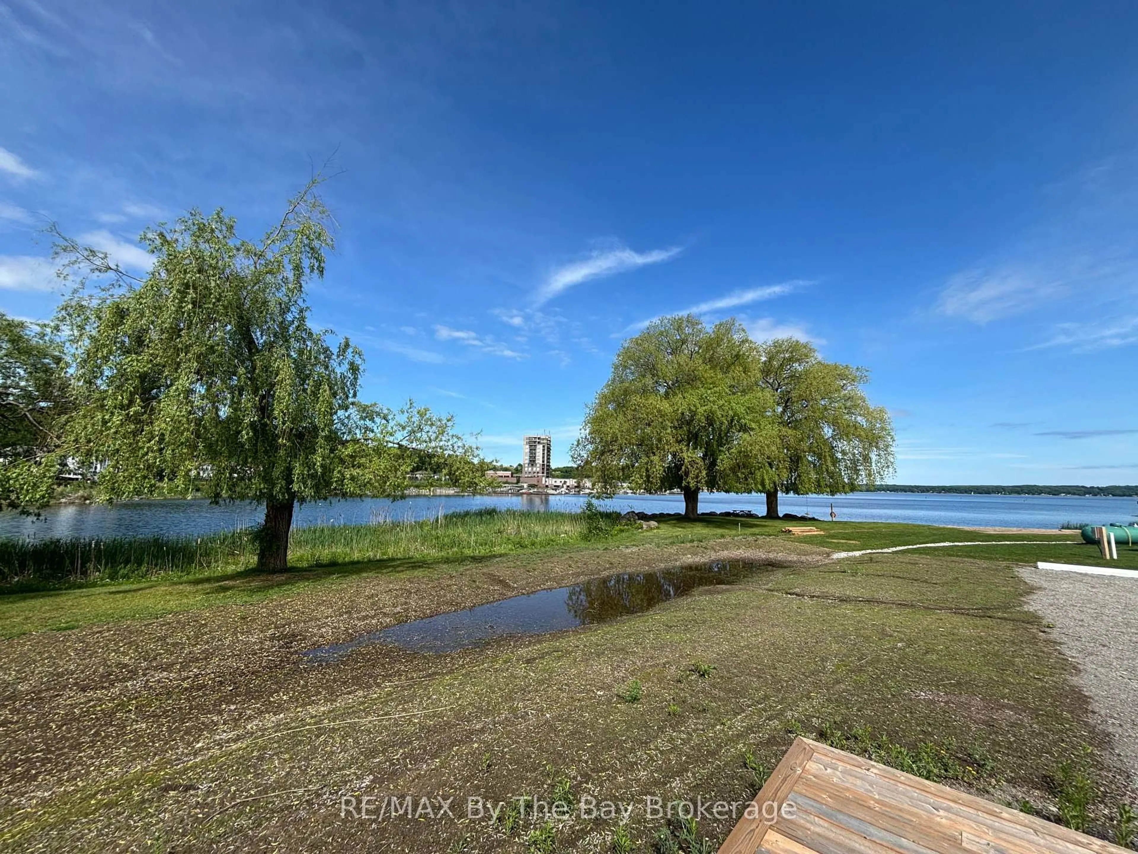 A pic from outside/outdoor area/front of a property/back of a property/a pic from drone, water/lake/river/ocean view for 3282 Ogden's Beach Rd #38, Tay Ontario L9S 2K6