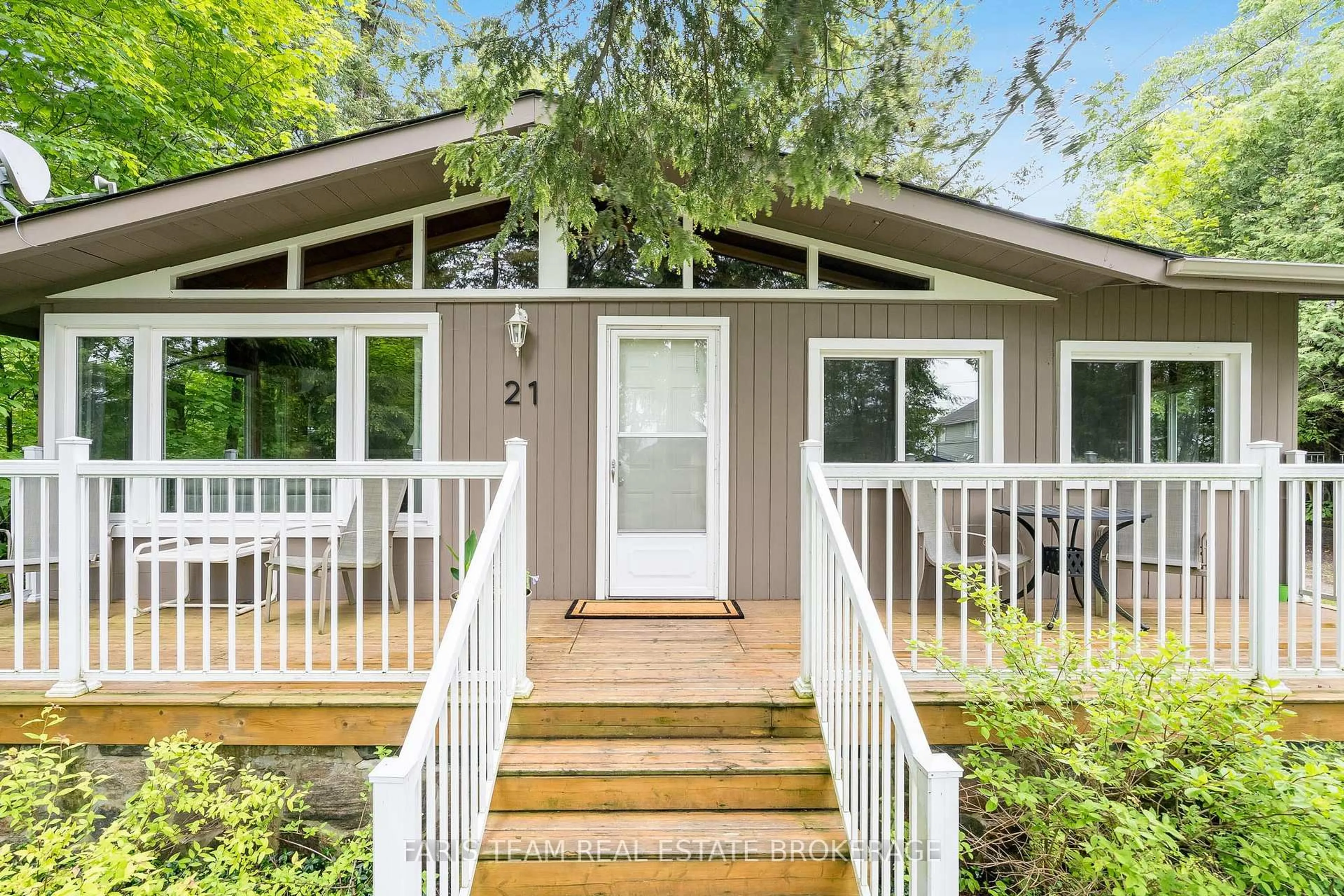 Home with vinyl exterior material, street for 21 East Beach Rd, Tiny Ontario L9M 0M6