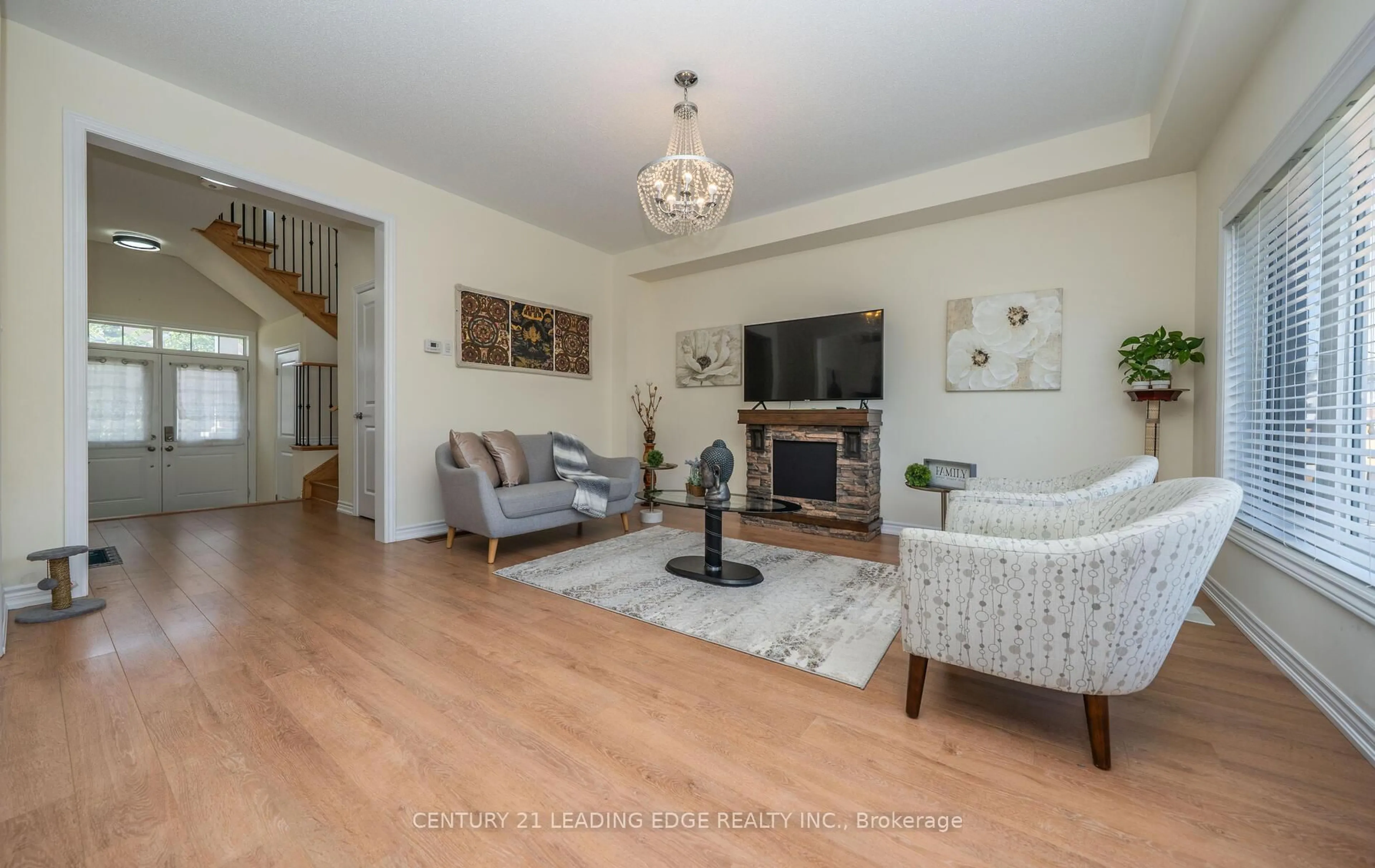 Living room with furniture, wood/laminate floor for 164 Allegra Dr, Wasaga Beach Ontario L9Z 0H6